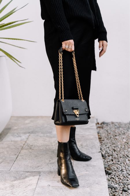I love wearing ankle boots that are black with a black bag and gold chain. Here's an example of a bag that would work perfectly for this look.  

#LTKSeasonal #LTKaustralia