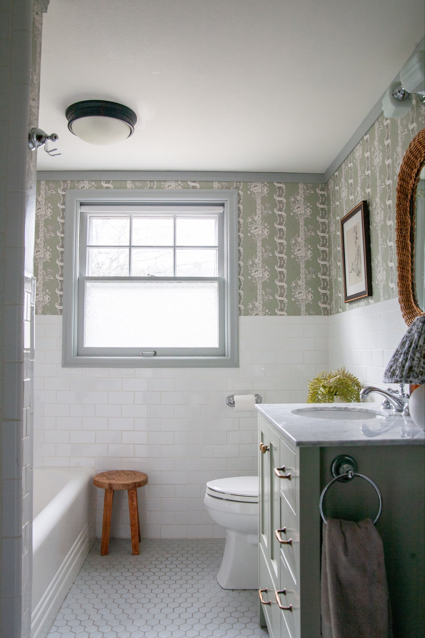 This bathroom deserves a shout out now that it’s basically done (for real this time). Now vs when we moved in in 2018. Blood, sweat, and tears (literally) went into the major reno in 2019 and then the wallpaper and painting the vanity were a piece of cake a couple months ago!! @sandbergwallpaper paper, linked everything else in I could in the app. 

#LTKhome