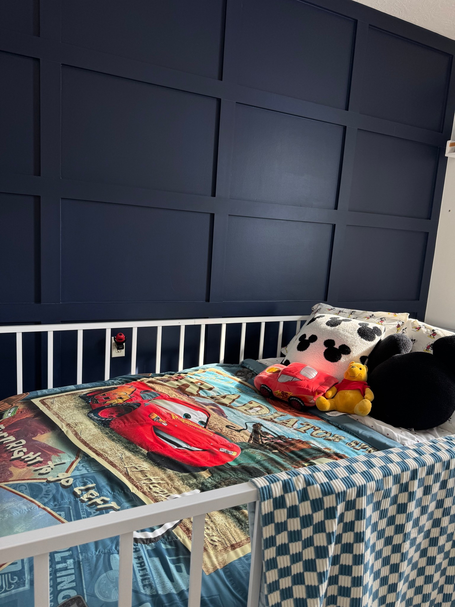 Toddler bed. Cars theme bedding. Disney bedding. Montessori floor bed. Checkered blanket. 

#LTKHome #LTKKids