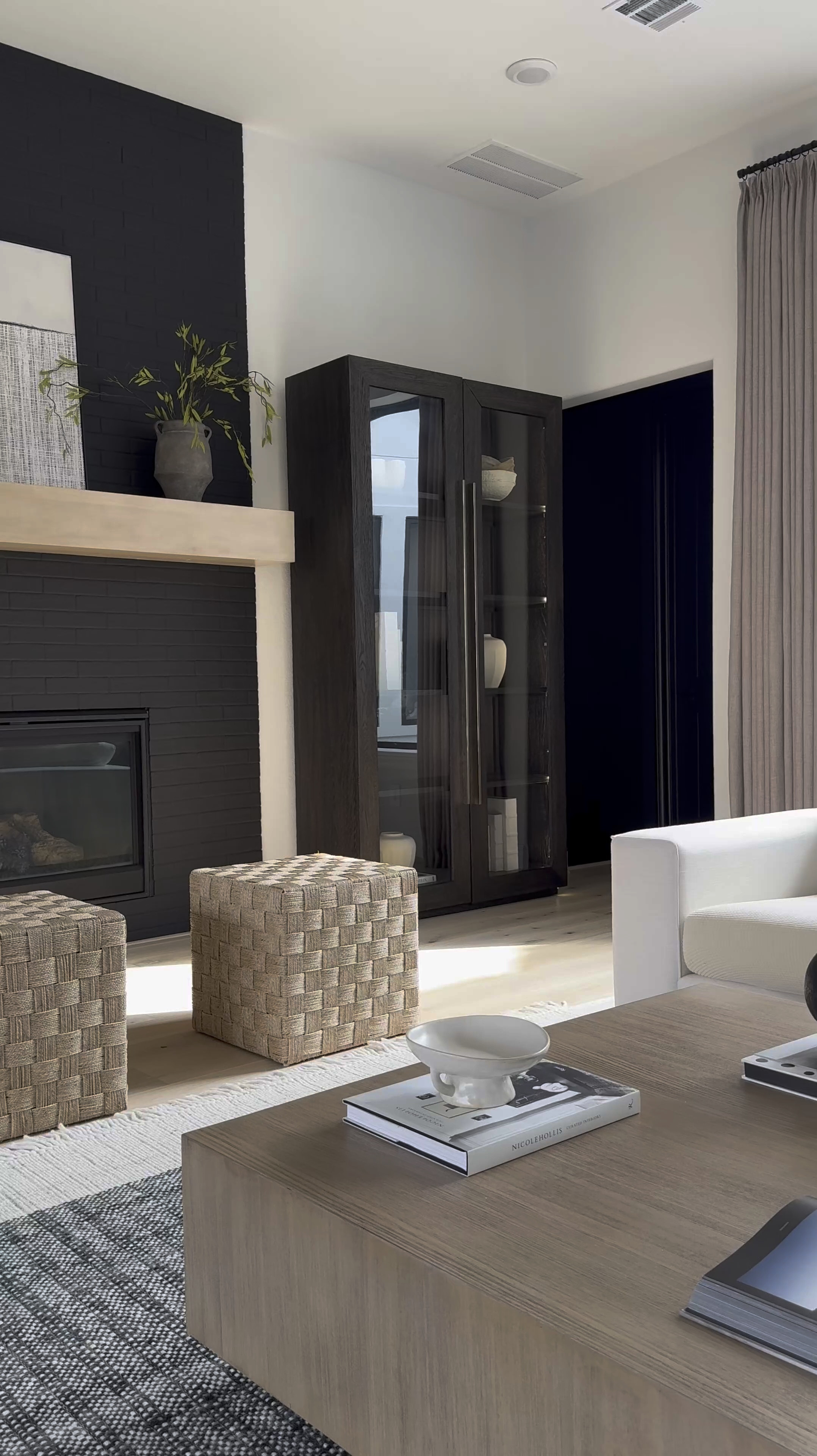 Happy Friday Friends!☺️
Add a stylish accent to your home with this Lynwood Checkerboard Woven Cube. This cube showcases a woven design with a checkered pattern, adding a distinctive accent to your space. Ideal for resting your feet or storing towels and throws, this natural shade cube is a versatile and functional addition to any room in your home. 

I’ve linked other items below 😁 including my drapes.🤍