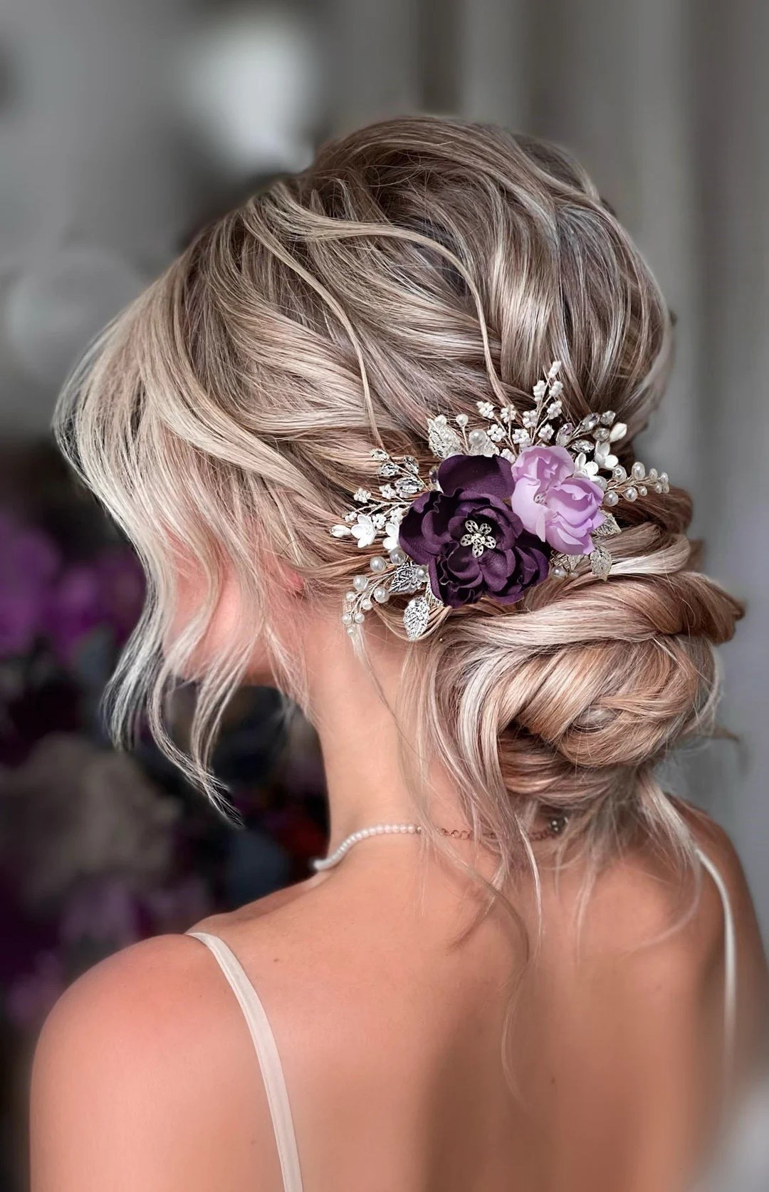 Add a romantic pop of color to your bridal look with this elegant purple silk flower hair comb. Featuring hand-painted lilac and deep-toned blooms accented with pearls, crystals, and delicate leaves, this piece brings graceful texture and sparkle to any hairstyle. The flexible design makes it easy to style in updos, half-up looks, or flowing curls—perfect for weddings, proms, or any special celebration. #bridalhair #purplewedding #weddingaccessories #bridalstyle #bohowedding #ltkbride #weddinginspiration

#LTKSeasonal #LTKSpringSale #LTKWedding
