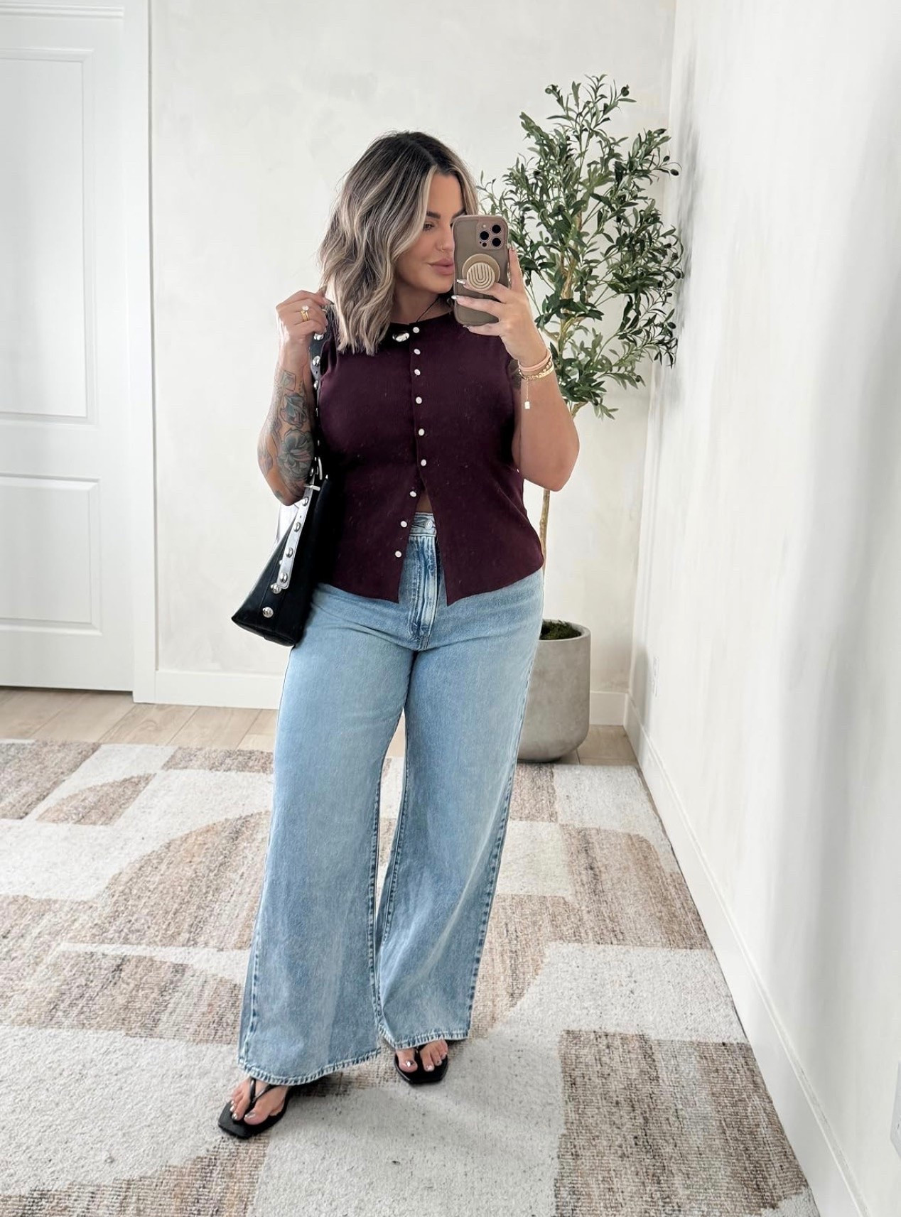 Jeans 32x31 length I would recommend sizing up in these I’m typically a 31 I did a 32 I would also get the 33 length if you want to be able to wear a heel if you are 5’5 or taller. I got the 31 length and can only wear flat with these. 

Tank linked similar this one is old .