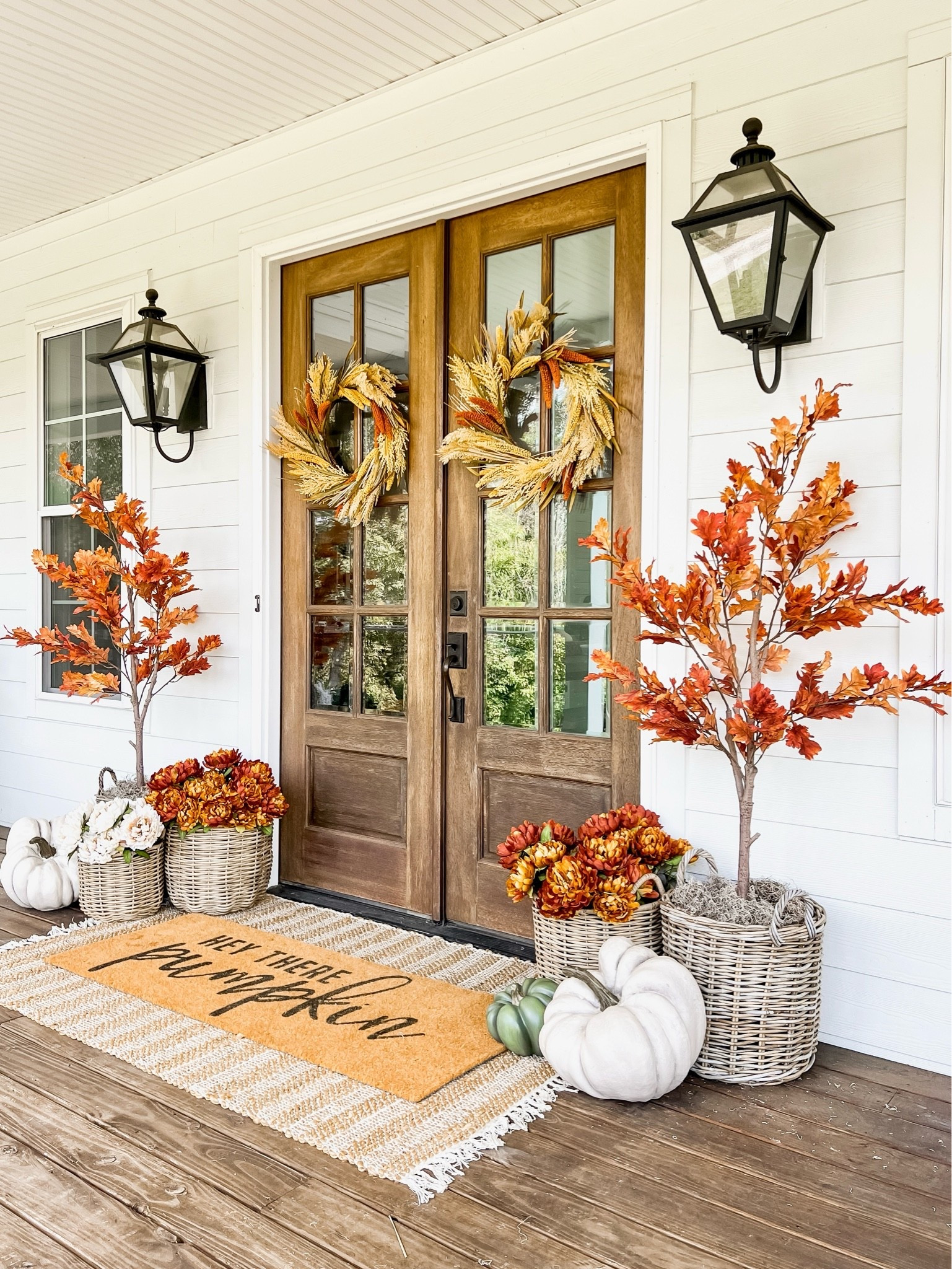 fall porch decorating idea for 2026! This was my front doors decorated for fall three years ago in all the orange tones!

#LTKSeasonal #LTKHome #LTKSaleAlert