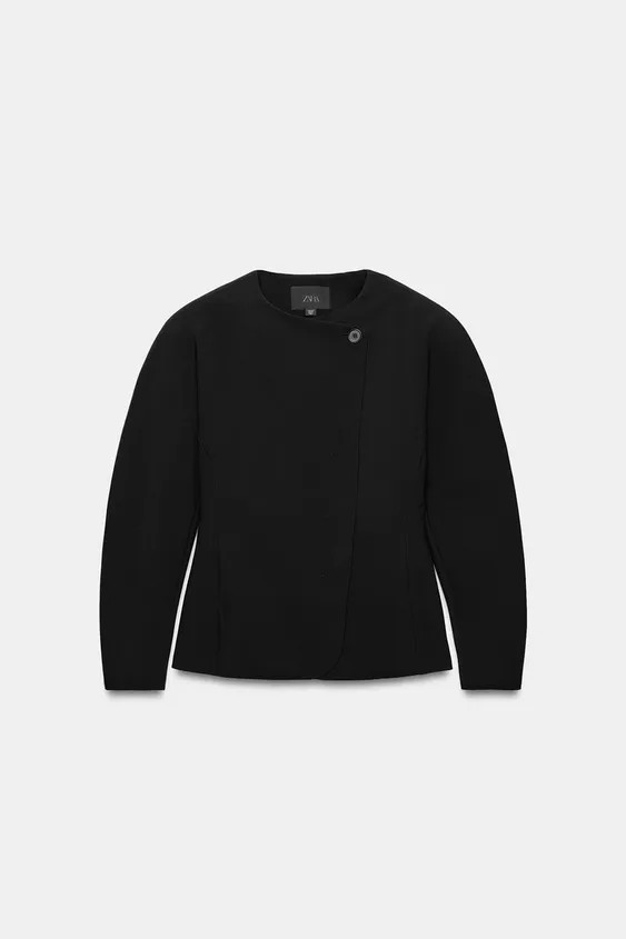 Voluminous blazer with a round neck and long sleeves. Featuring a matching interior lining and do... | Zara UK