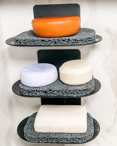 One of our passions is figuring out solutions for our clients and often that involves creative ways to store items. Case in point: how to store shampoo & conditioner bars in the shower in a way that keeps them from getting all soggy and gross as well as maximizing the space we have available to us in a shower niche.

We used these adhesive wall mount soap dishes plus the woven soap saver pads to create a perfect setup for regular soap (bottom), shampoo bars (middle), and conditioner bar (top). 

These bars can last a really long time with proper care (our client has had that conditioner bar for over 6 months!) so they are money-saving and eco-friendly. These particular shampoo/conditioner bars are from @thegoodfill but you can also get good options online or most zero waste shops. Check our Amazon store (link in bio) for links to the soap holders & pads plus a few options for shampoo & conditioner bars! Or if you are in Nashville - check out The Good Fill!