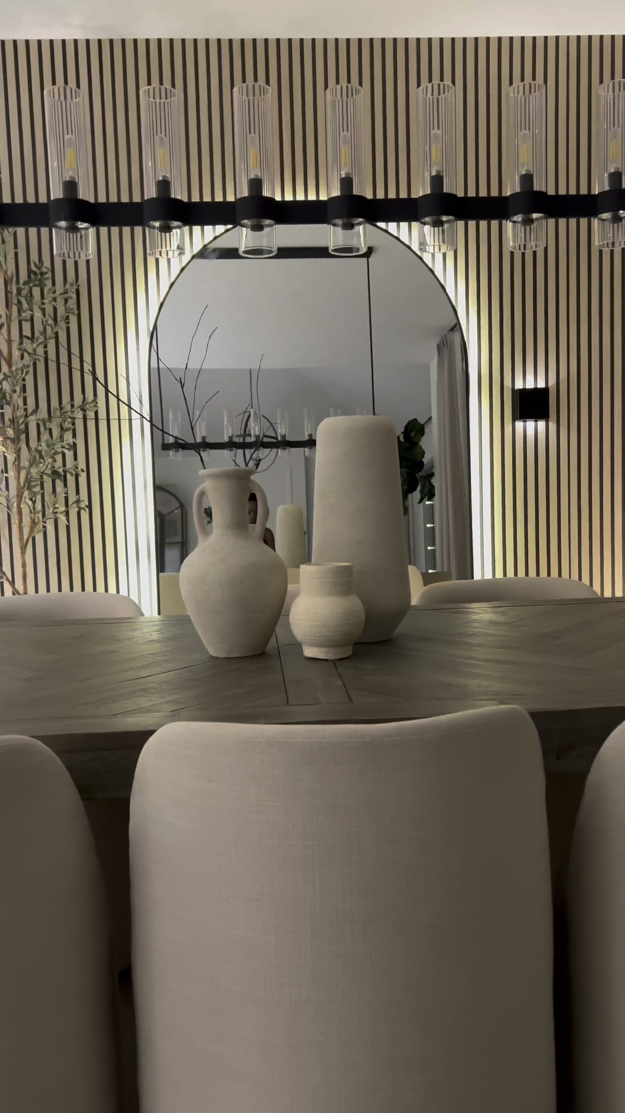 (I used color Wood A)

 Hey friend! ☺️

So here’s a simple way to upgrade your wall and get the wooden slat look with wallpaper! 🎉

Tips: 
Wallpaper is peel and stick so to remove, use a blow dryer so you don’t mess up your paint or drywall ☺️ I used 3 rolls. My wall is 9ft by 10.5ft 

This is by far the simplest wallpaper I’ve installed. The design is forgiving, so even if you overlap a bit more than you’d like, it isn’t noticeable… making install even simpler. 

I added plug in 16 ft LED light strips to the back of the mirror. Color is warm white or 3000K. 🔌 My mirror is 83inches in height by 48 inches. 🪞 

The sconces are my favorite addition to this wall! They are rechargeable. 🎉 They attach to the wall in two ways - They come with screws & a peel and stick adhesive….. which attaches to a magnetic metal piece which makes the sconce removable without having to reinstall it. 💕

I’ve linked the rest of the items below! ☺️
#LTKVideo

#LTKStyleTip #LTKHome