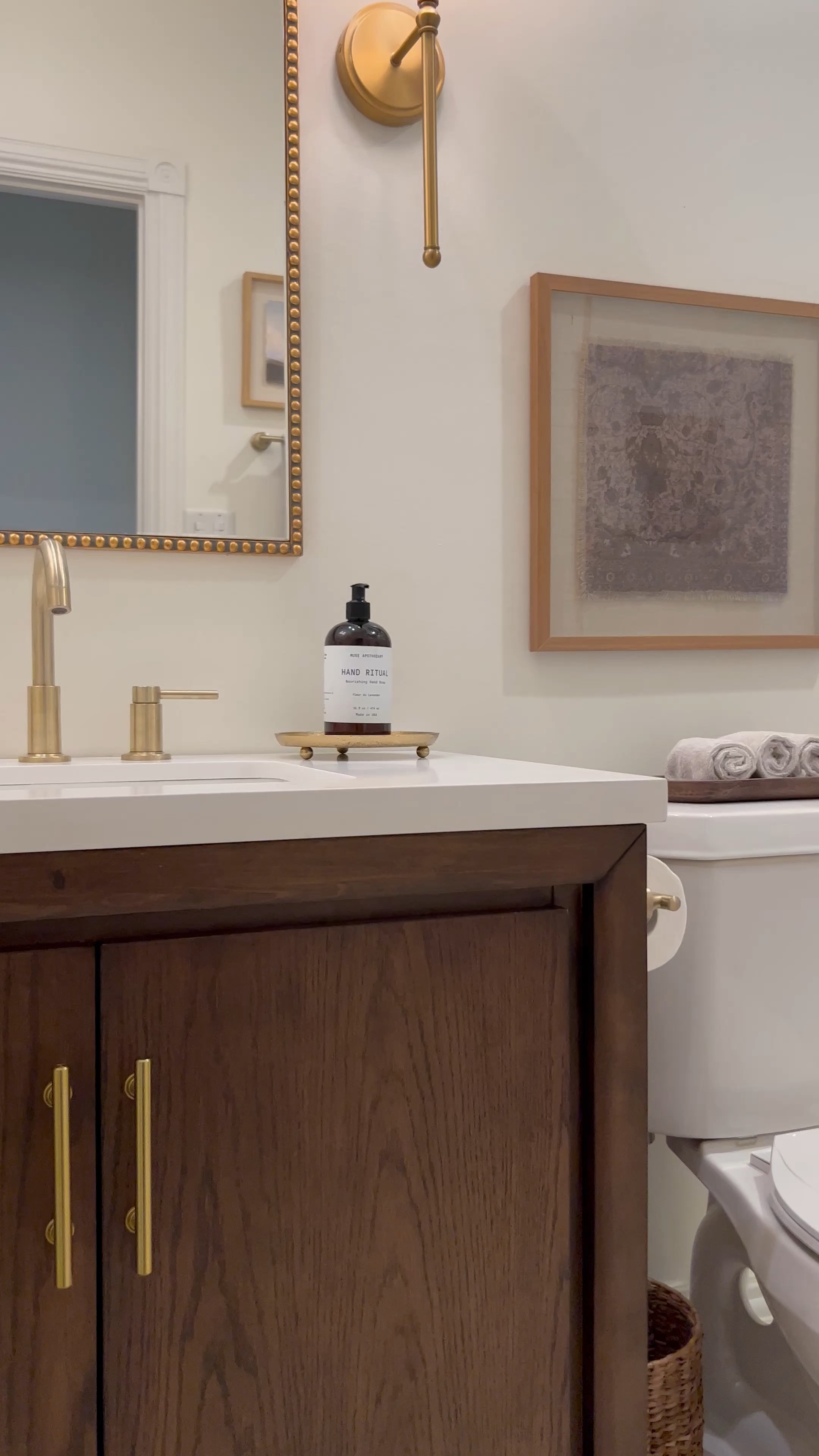 Bathroom remodel, bathroom design, bathroom decor, gold mirror, gold sconce, bathroom accessories, soap dispenser, brushed gold faucet, gold shower head, bathroom vanity.

#LTKhome #LTKstyletip #LTKunder100