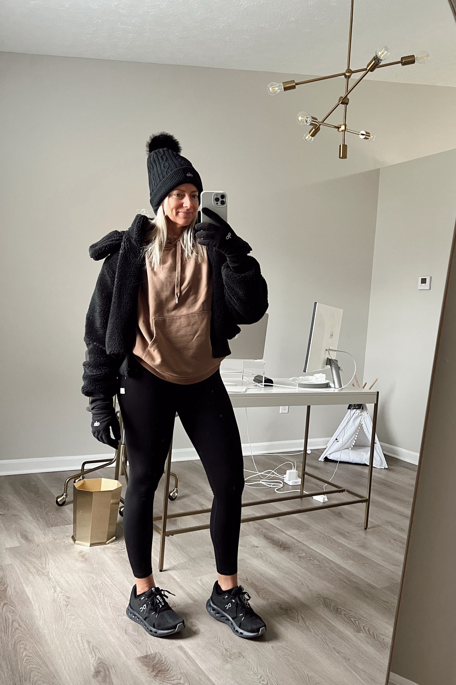 The best part is honestly my new alo socks that you can’t see. 🙌🏼👀🧦 So comfortable and great at wicking away sweat during my workouts. AND I discovered the best leggings💯

Wearing size medium in the jacket, small in the hoodie, small in the leggings, size 8 in shoes. All fit TTS except jacket runs a little on the small size if you want a little more room for a hoodie underneath. 

I snagged the hat in 2 colors and the gloves before they sold out, but still other cute options left - linked below. 

Workout 
Leggings
Accolade
Beanie
Sherpa
Winter look
Outfit 
Black and tan 
On running shoes
Vuori

#LTKfitness #LTKstyletip #LTKshoecrush