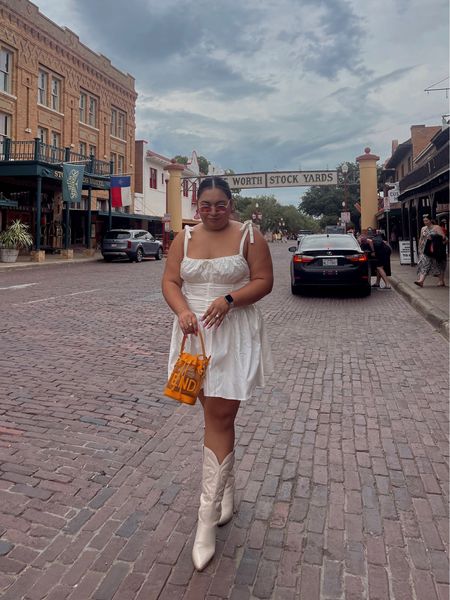 Summer whites with a pop of color 🧡🩷

white dress, white cowboy boots, orange handbag, pink sunglasses, pink earrings, country concert outfit, corset dress, Nashville outfit 

#LTKSeasonal #LTKcurves #LTKstyletip
