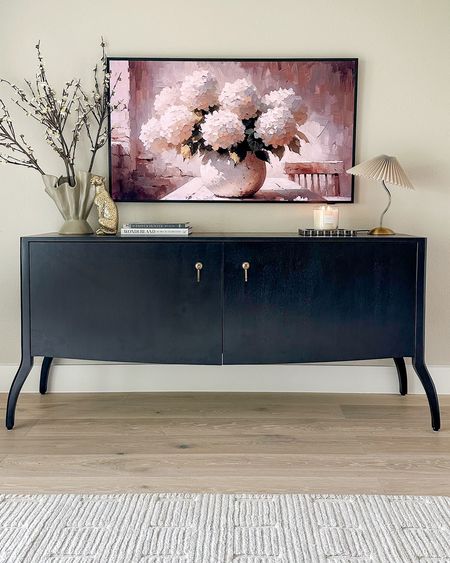 So in love with the style of this console and it’s currently on SALE for 20% off! Perfect as a tv stand, it has an opening in back for cords as well as shelf storage! This is a 55” Frame TV.

#LTKStyleTip #LTKSaleAlert #LTKHome