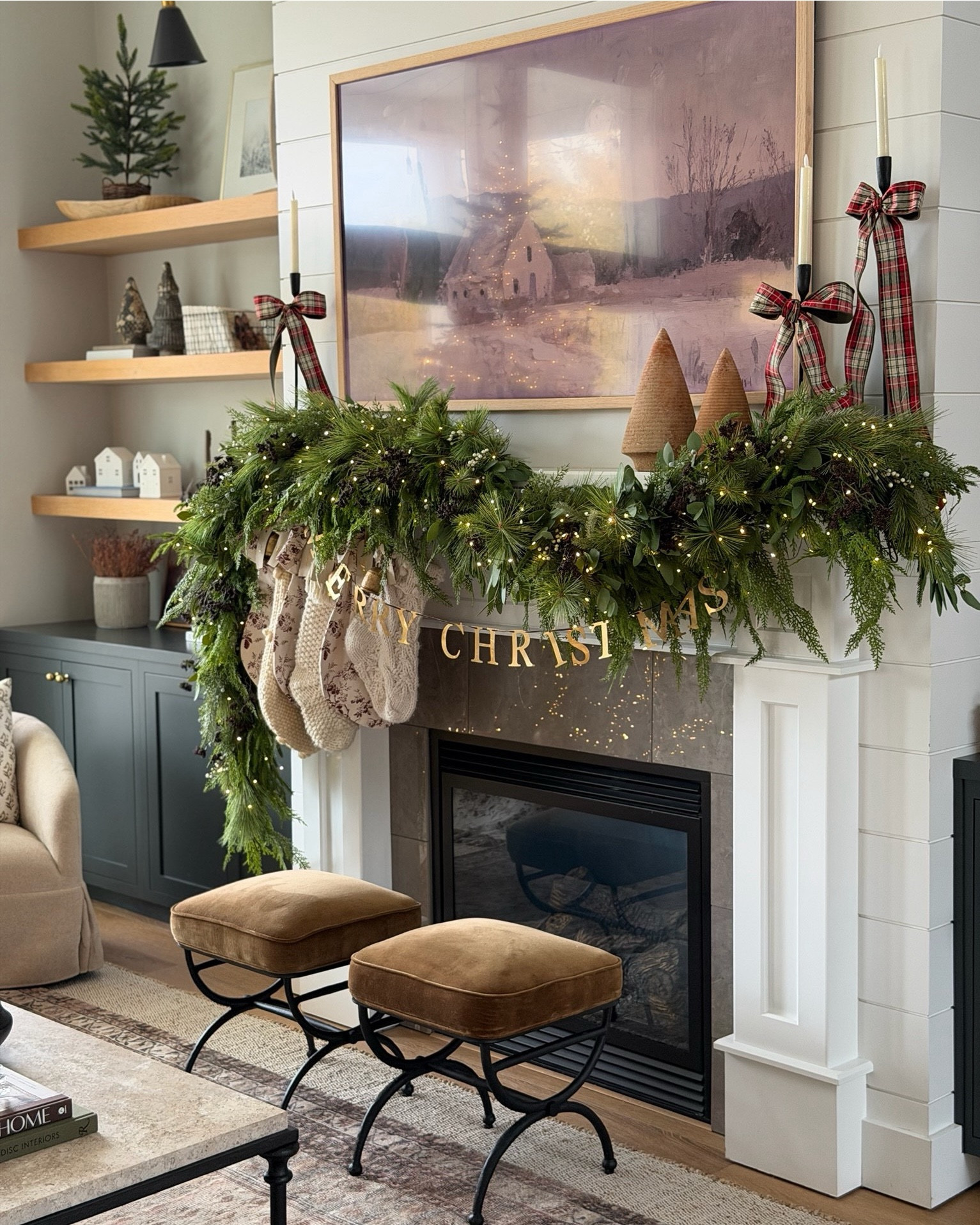 Our 2025 Holiday Mantle!  Each Christmas I use the same garland strands and substitute in new fillers, stockings, ribbon, and smaller accessories for a fresh look. I feel like each year it gets better than the year before! I love how organic and full our mantle looks. A new favorite for sure! 

#LTKHome #LTKSaleAlert #LTKHoliday