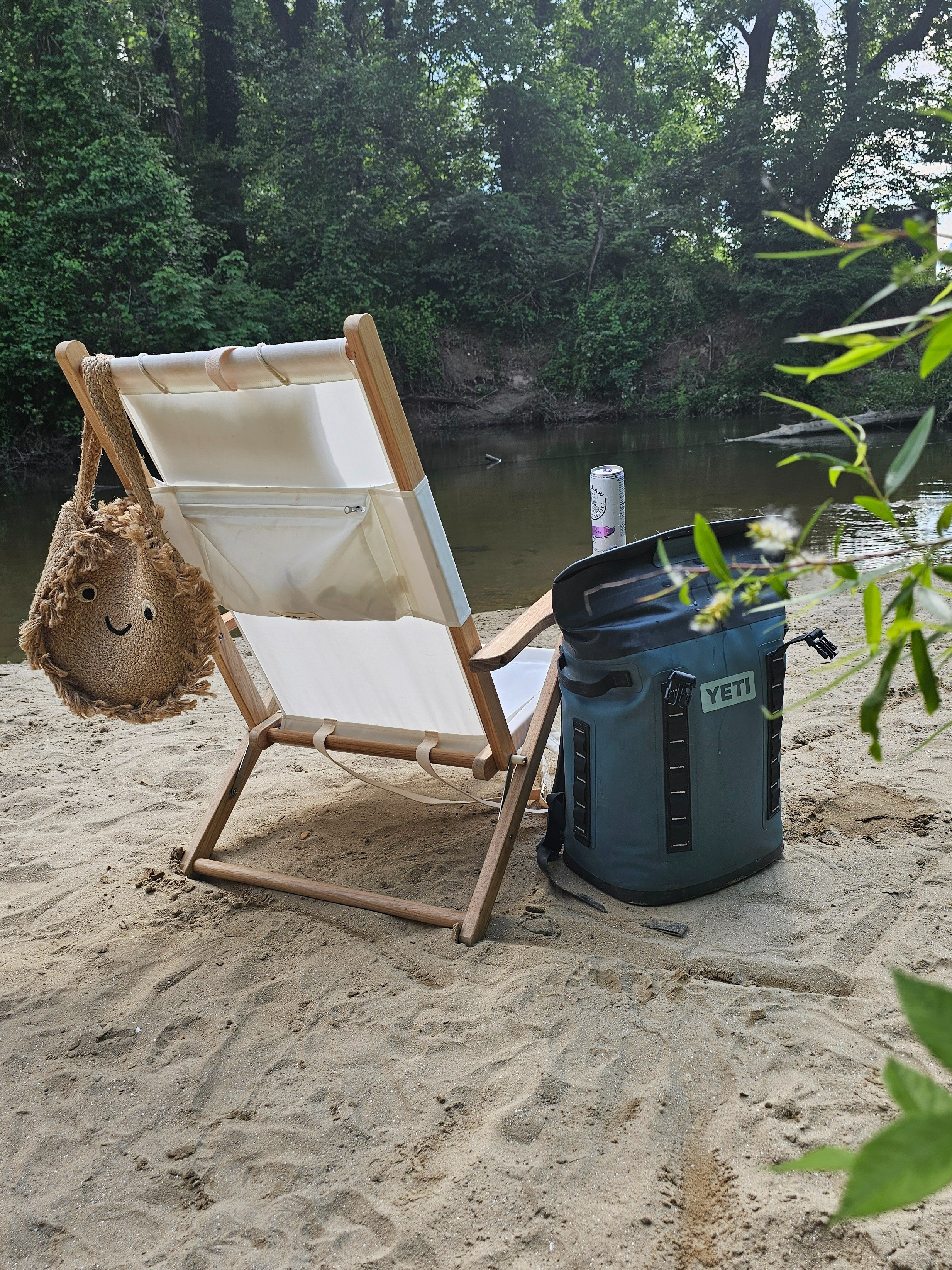 ON SALE! Beautiful neutral beach chair that reclines and has a pocket for your cell phone! Has attached shoulder straps for easy carrying.

