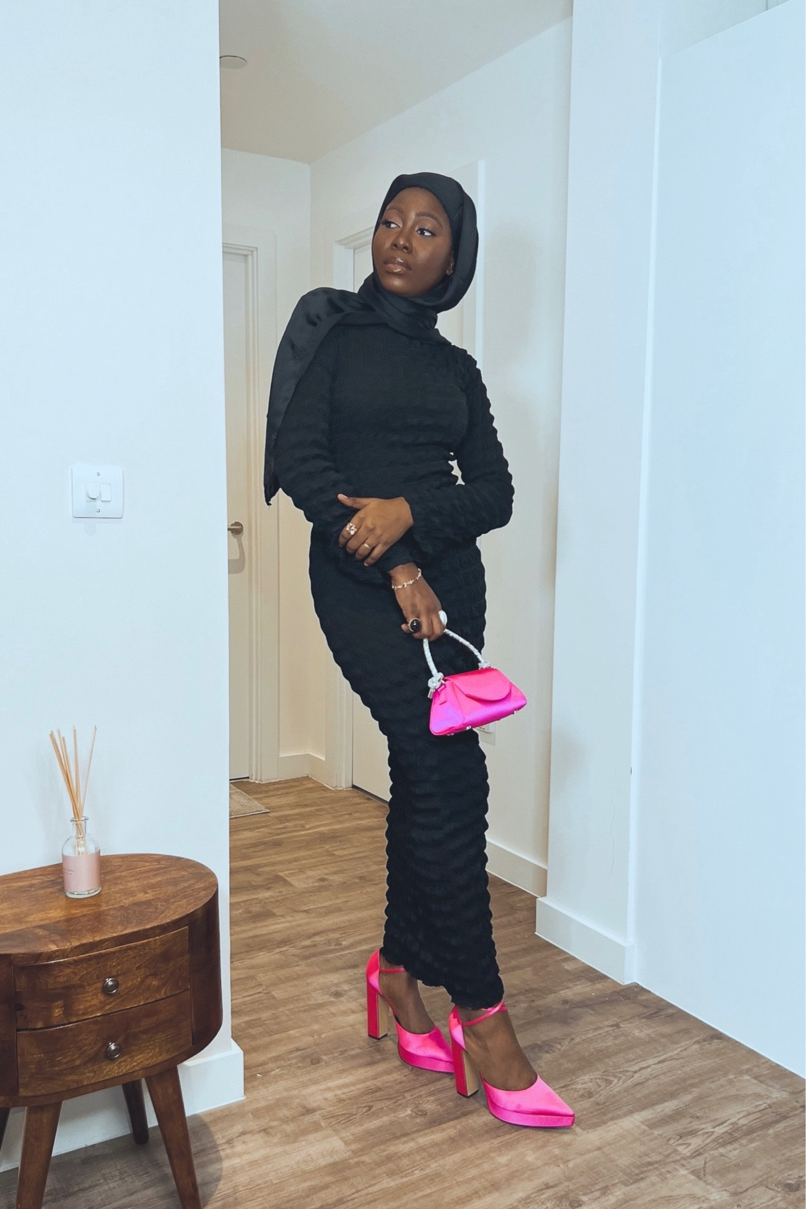 black dress with pink heels