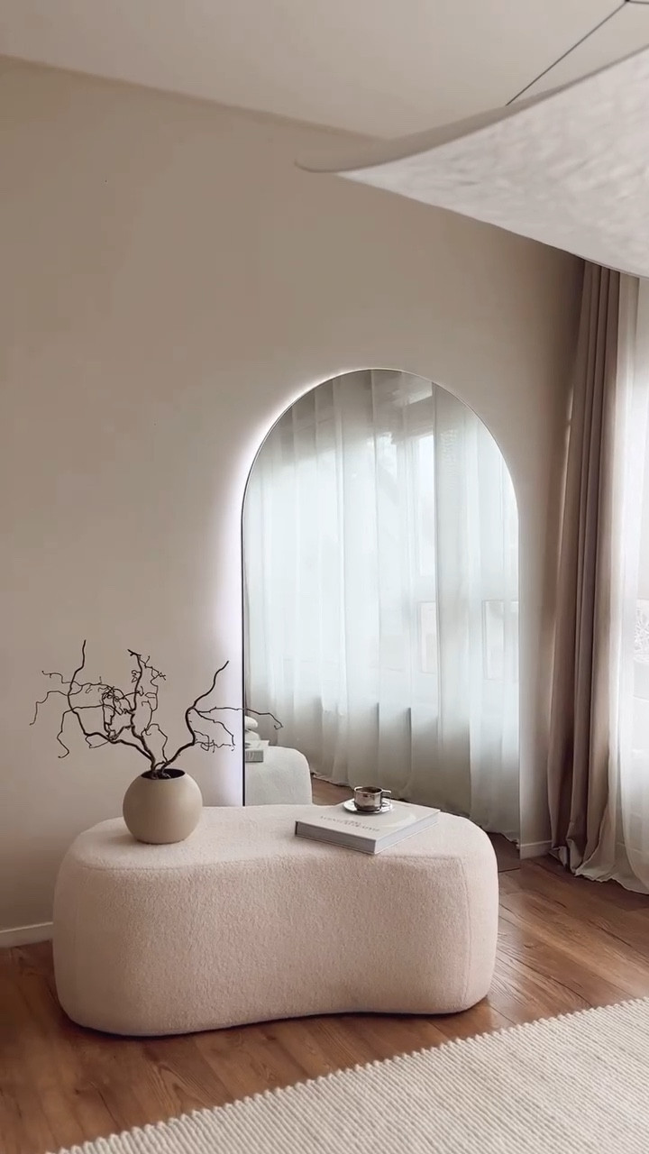 Soft textures, warm neutrals, and sculptural details — this space brings all my favorite elements together 🤍 From the curved mirror and ceramic vases to the sheer curtains and cozy area rug, every piece adds softness and depth. I love how the minimal benches blend seamlessly into the room without overpowering the calm aesthetic. It’s all about creating a space that feels light, layered, and lived-in. I’ve linked everything on my LTK to help you recreate this look. #NeutralDecor #WarmMinimalism #InteriorInspo

#LTKHome #LTKU #LTKSaleAlert