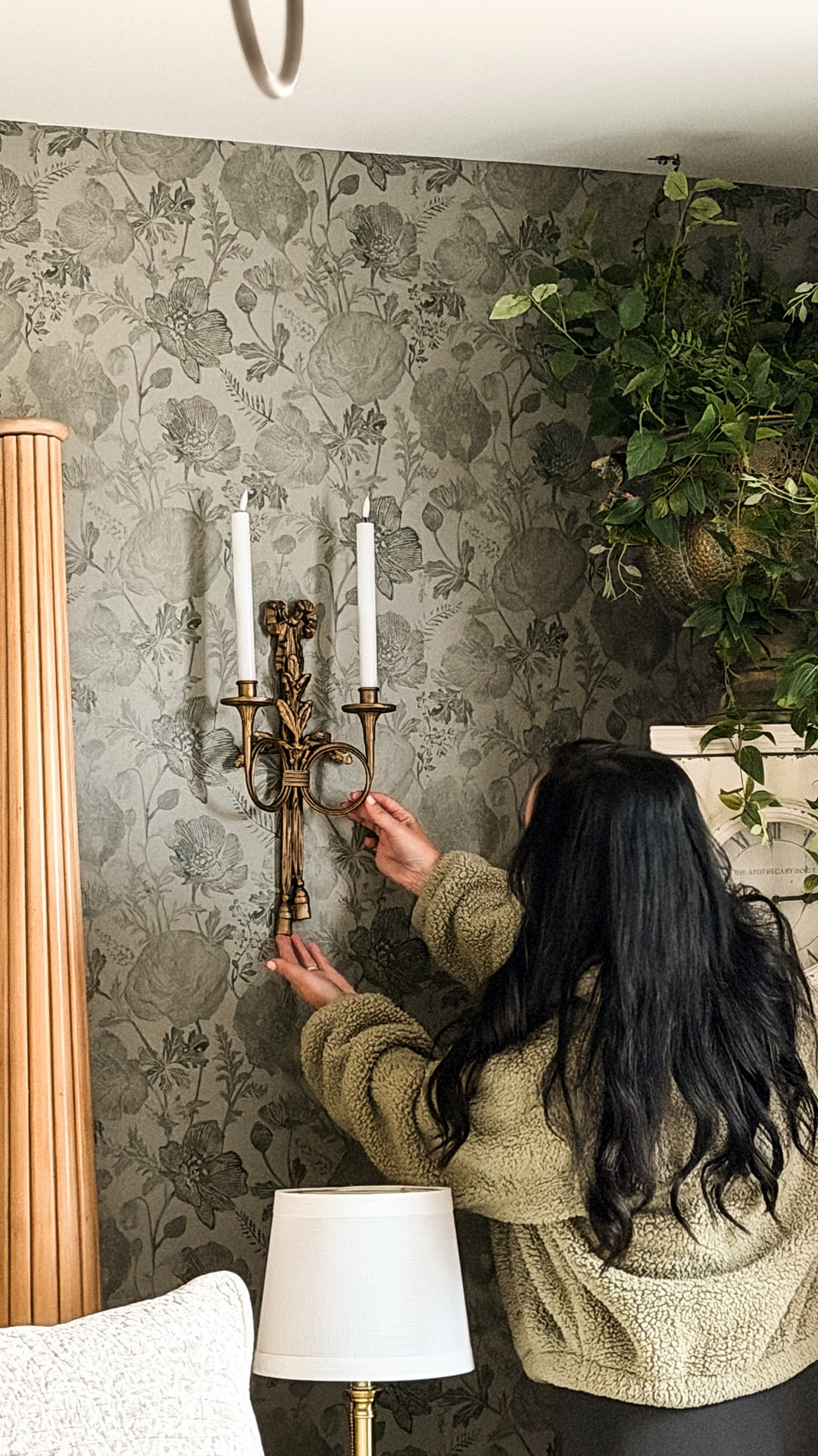 Series three of our primary bedroom makeover & this one is all about lighting as design.

I found these bronze cast iron sconces from @decorsteals & instantly knew they were meant to live on either side of our bed. They bring that old world charm, collected cottage elegance, & a softness that makes the room feel finished without feeling heavy. And the best part… they are battery operated with a remote, which means no hard wiring, no wall damage, & no hesitation to design boldly.

This room has been such a slow layering of intention. First the antique farmhouse mantel. Then the moody floral wallpaper. And now these sconces that glow like they have always belonged here.

This is how you transform a builder grade bedroom into something that feels romantic, timeless, & deeply personal. One thoughtful choice at a time.

The journey is not over yet, friend. This space is still becoming, & I am loving every single step of it. 🤍 xo, Krystle

#LTKHome #LTKFindsUnder100 #LTKSeasonal