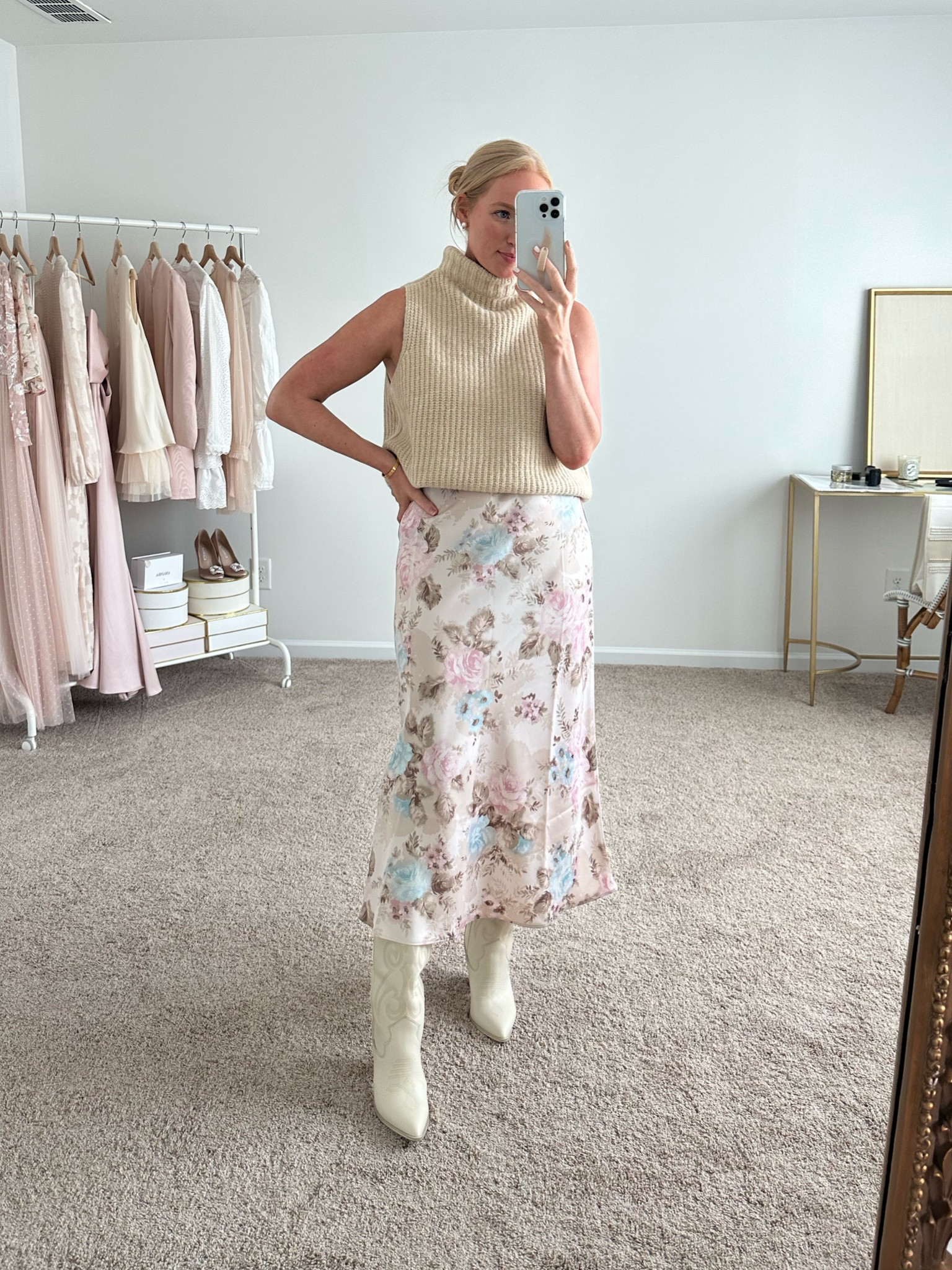 Nordstrom anniversary sale sneak peek!! The sleeveless sweater is so soft and will transition you from summer to fall.. but you can also easily layer it under cardigans and blazers without the bulk in your arms! It runs big, i got a medium but wish I got a small! The floral slip skirt is stunning and another great transition piece you can wear now and later. I got a medium and it also comes in mauve and black. I paired with a white western boot, which is an easy way to incorporate current fall trends  

#LTKsalealert #LTKSeasonal #LTKxNSale