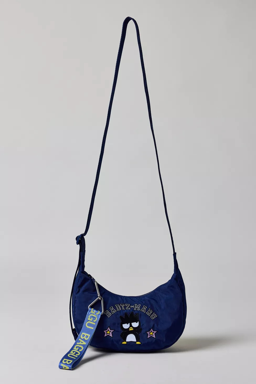 BAGGU X Hello Kitty And Friends UO Exclusive Badtz-Maru Small Nylon Crescent Bag | Urban Outfitters (US and RoW)