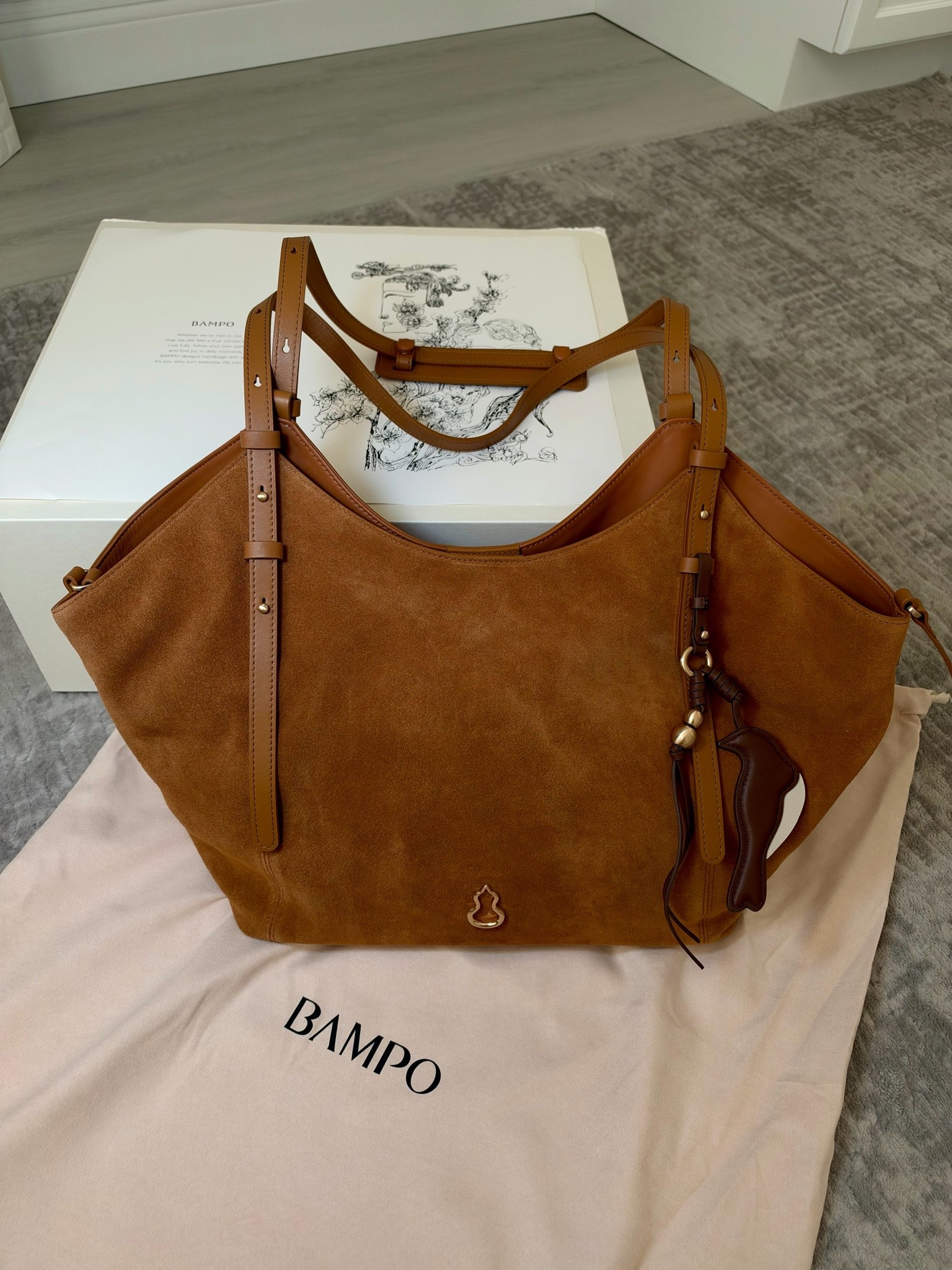 New bag for fall from @Bampo 
Amazing quality and price point. Comes with a makeup pouch and a fun charm. Double sided. Suede on front and leather on the back!

#LTKdayinmylife #LTKootd #LTKgrwm