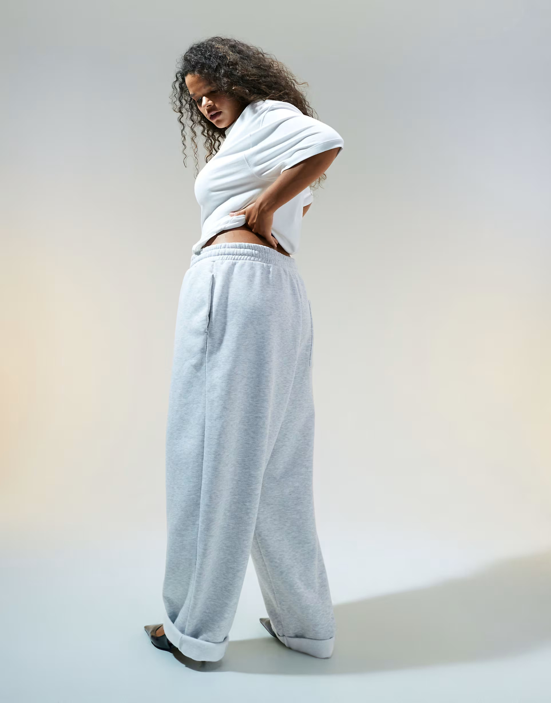 ASOS DESIGN Curve oversized sweatpants with turnback hem detail in gray heather | ASOS (Global)