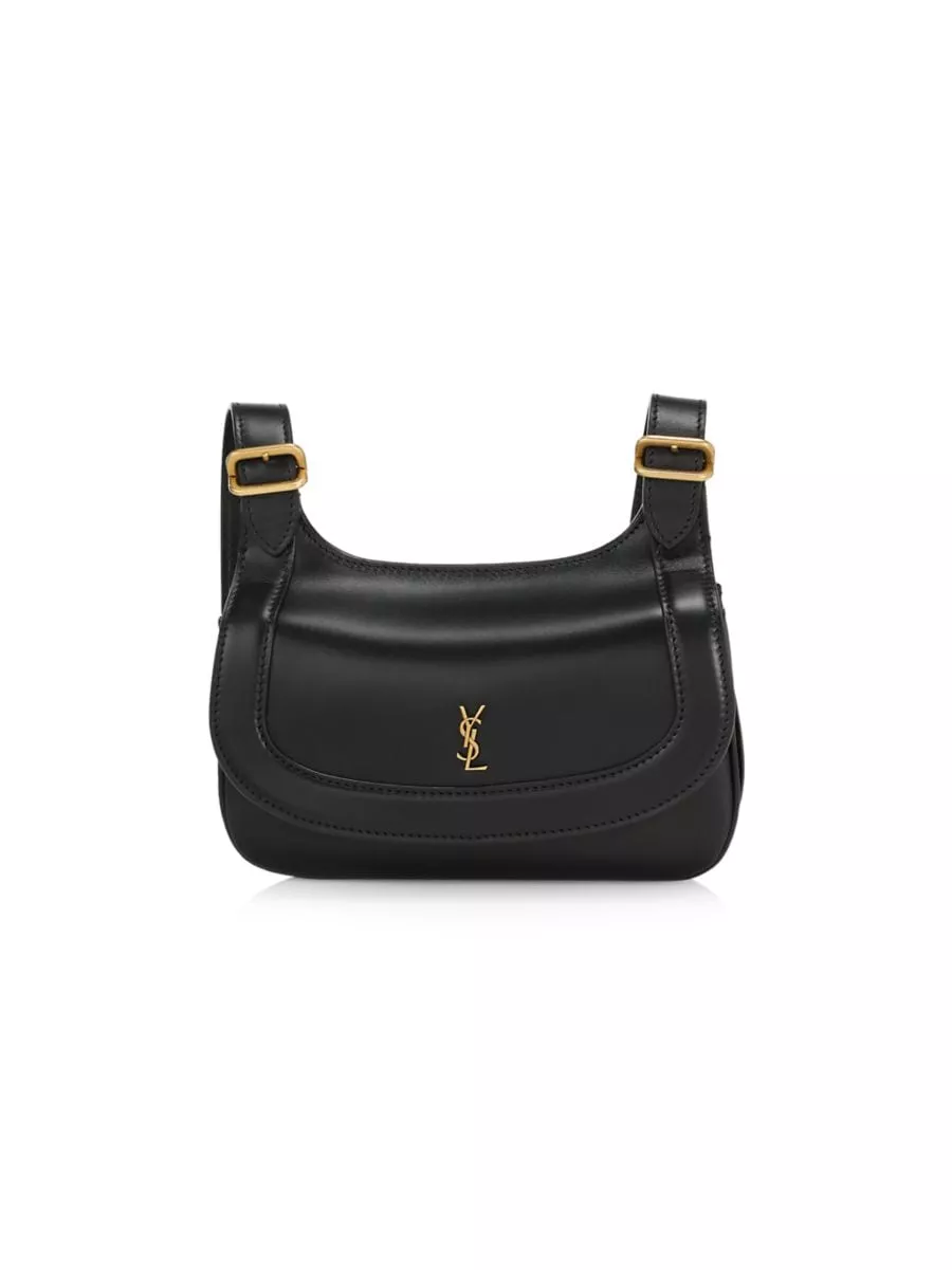 Who made Jennifer Aniston's black turtleneck top, leather handbag