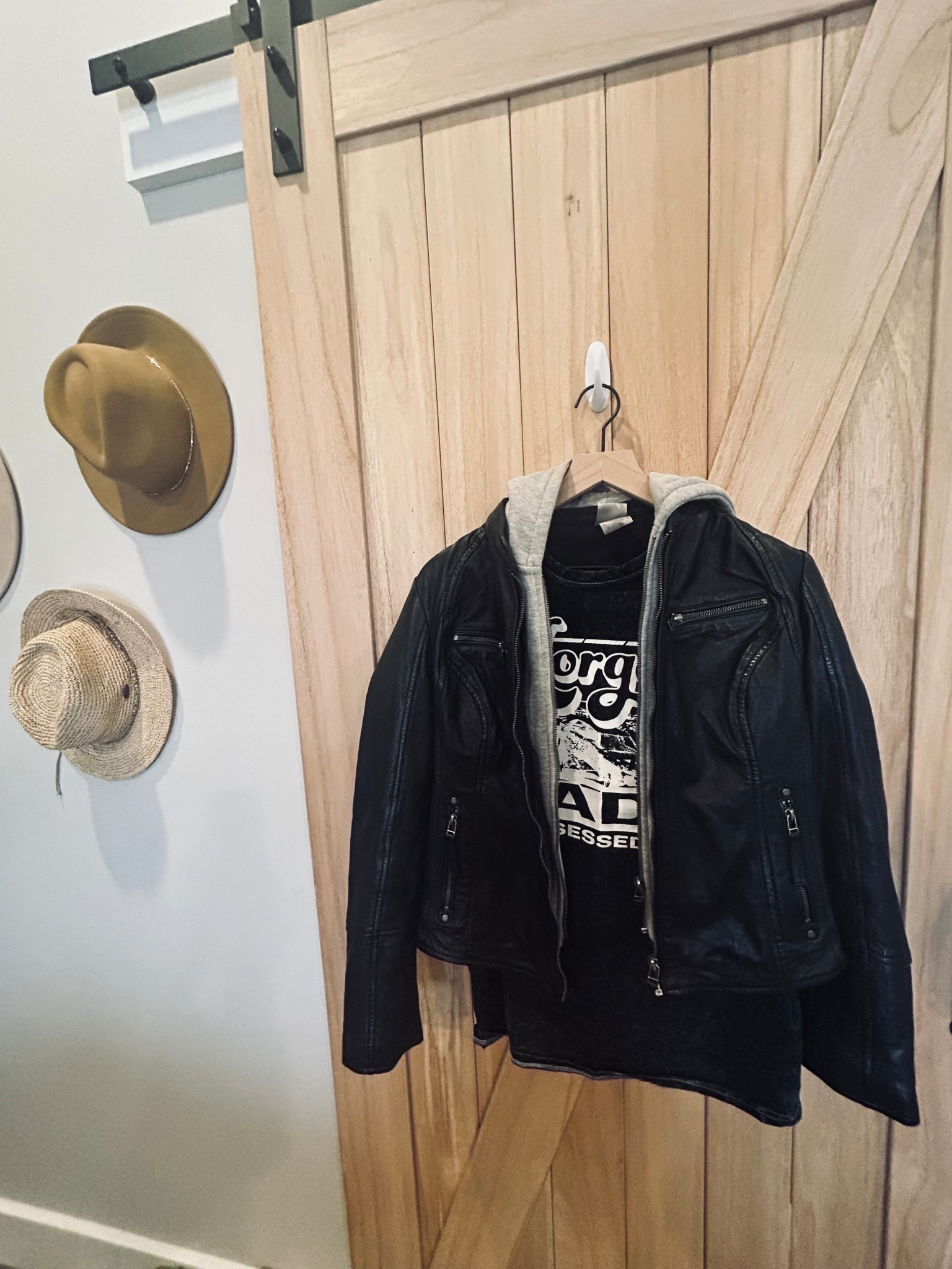 Leather jackets + graphic tees will forever be a trend. 🖤 

This black moto jacket with the hoodie insert is my go-to for that effortless country-rock vibe. Perfect for concerts, chilly nights, or throwing over a graphic tee and jeans. The layered look makes it feel styled without trying too hard. Paired it with my Morgan Wade concert tee for a vintage country look. 

It runs a little snug.  I bought it in a size 8 and it’s perfect.  5’9/140lbs/size 27/S #leathermotojacket #concertoutfit #countryconcertstyle 

#LTKTall #LTKOver40