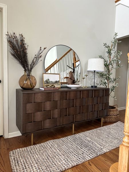 Sideboard styling for winter ❄️

Natural wood sideboard with exposed legs, mid century modern furniture, entryway decor, entryway rug, runner, round wall mirror, winter decor

#LTKhome #LTKstyletip #LTKSeasonal