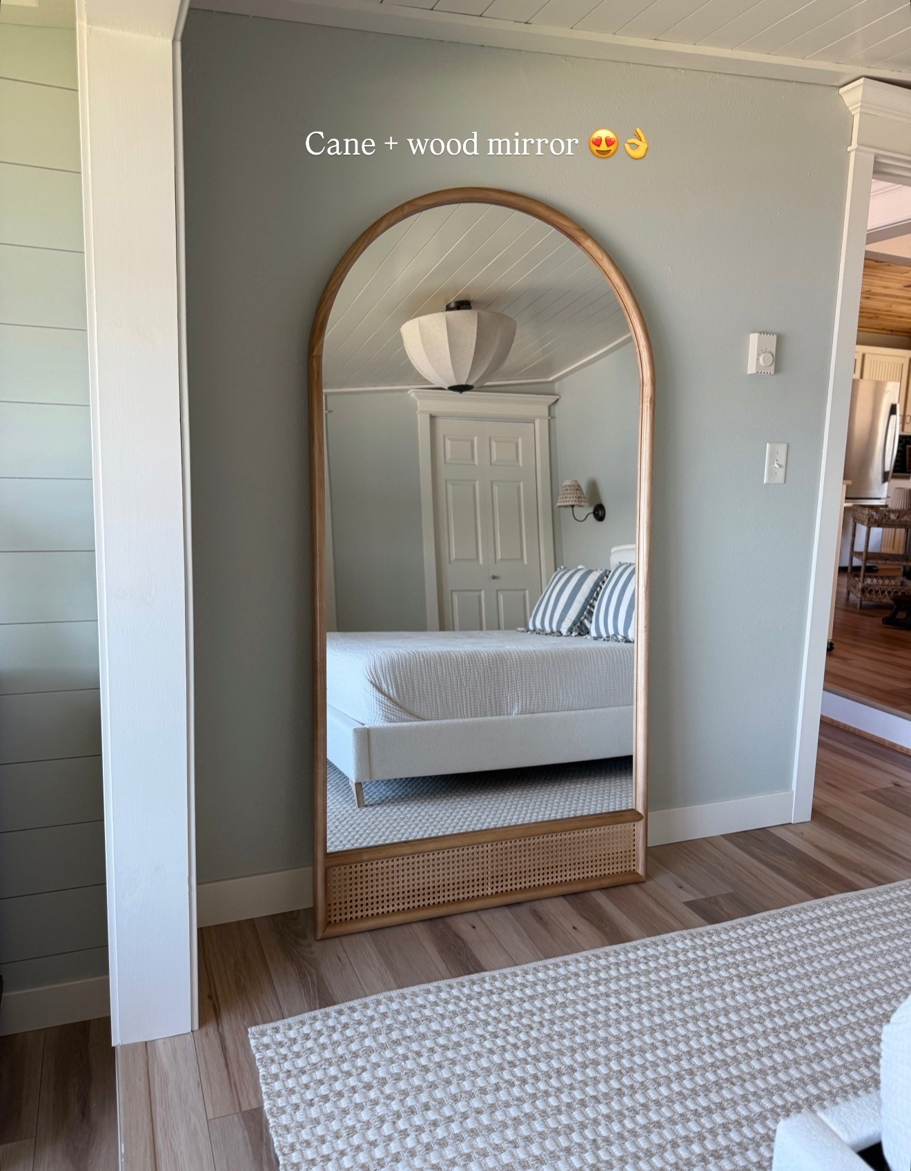 Love this cane and wood mirror. It’s huge!

#LTKHome