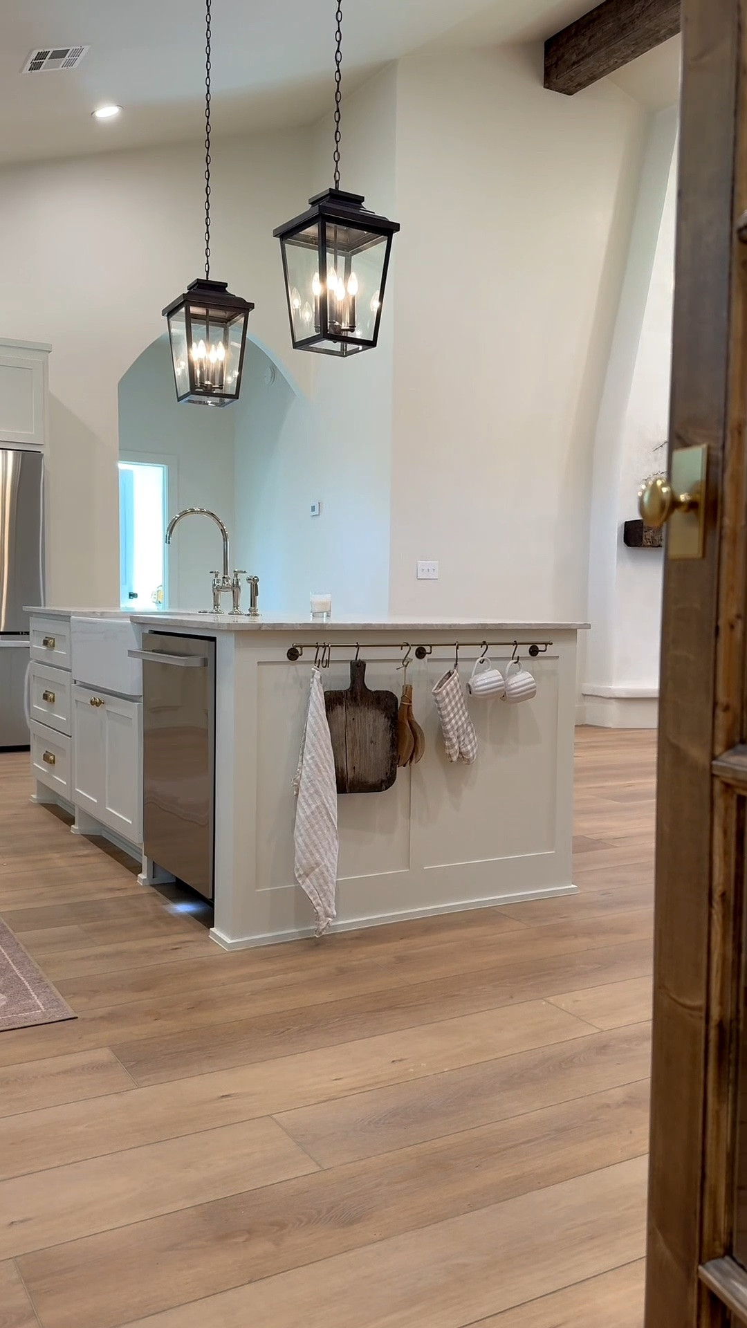 The kitchen in the flip house is what dreams are made of! I love this LG dishwasher from @lowes — the dishes were actually completely dry after a one hour wash and dry. Linking other decor here! I get lots of questions on these cute scalloped counter stools and they are linked. The lantern pendants are also from @lowes but I had clear glass cut for them. They come with seeded glass. The stone is Alamo sandstone random ledger panel from floor and decor. The cabinets and walls are shoji white - Sherwin Williams.

#LTKHome
