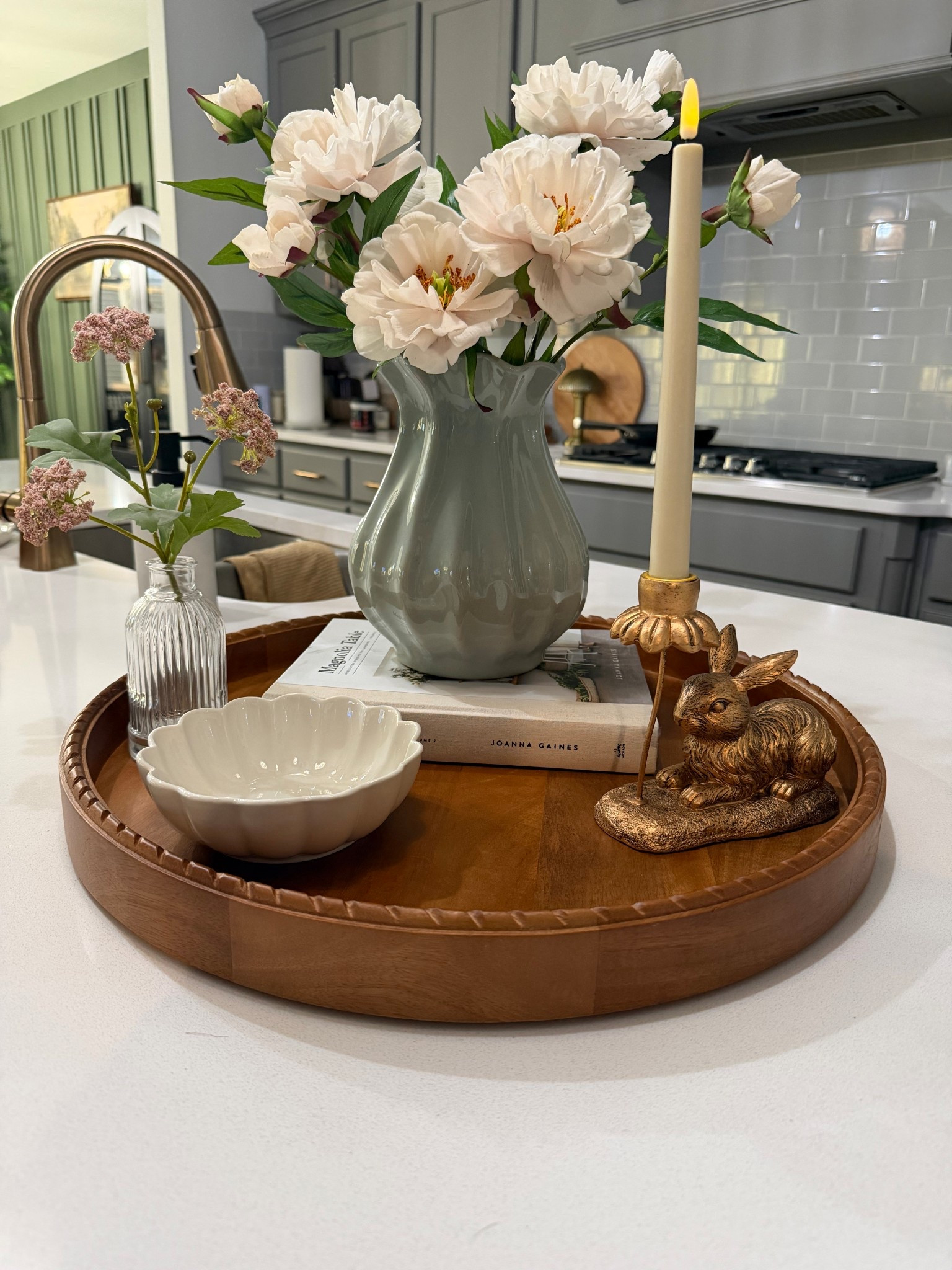 Spring styling on my kitchen island is officially done 🌸✨

This oversized McGee wood tray is my go-to base, and I kept it simple so it can transition straight into Easter. The My Texas House scalloped bowl and the sweetest bunny candlestick holder are both such good finds, and at these prices?! So good. 

Add in soft peonies and a neutral vase from Hearth & Hand, and one statement taper and you have a layered look that feels designer without the designer price tag.

If you’re starting to decorate for spring, these pieces are an easy yes. I linked everything in the comments for you 🤍

#LTKhome #SpringDecor #MyTexasHouse #EasterDecor #KitchenIslandStyling
@Target Style @Walmart @target 

#LTKHome #LTKSeasonal #LTKSaleAlert