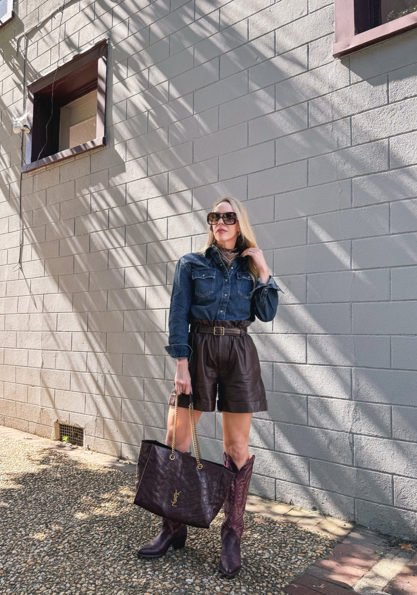 Western chic fall outfit with @levi denim shoulder pad shirt, paisley silk scarf, brown leather shorts, @Tecovas burgundy cowboy boots

#LTKSeasonal #LTKOver40 #LTKSaleAlert