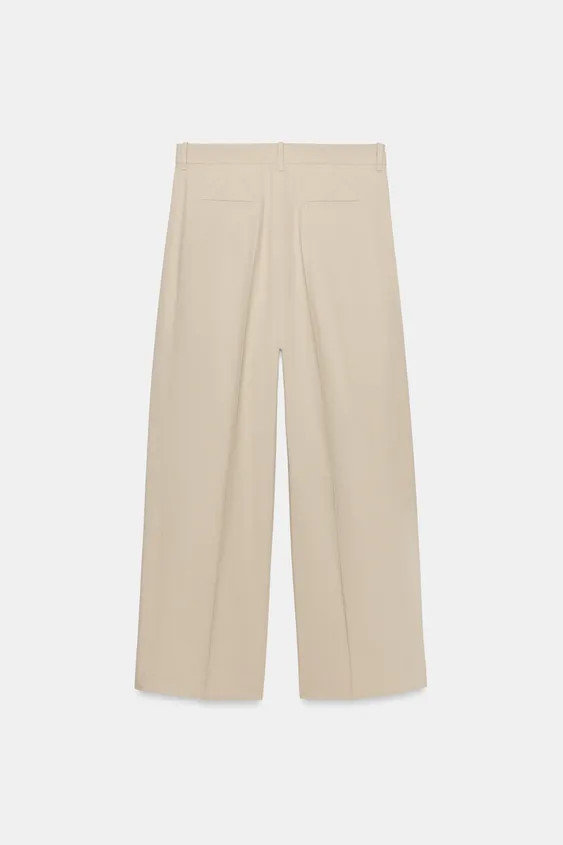 ZARA WOMAN COLLECTION. Pants crafted from cotton yarn. Mid-rise with belt loops. Concealed side s... | Zara US