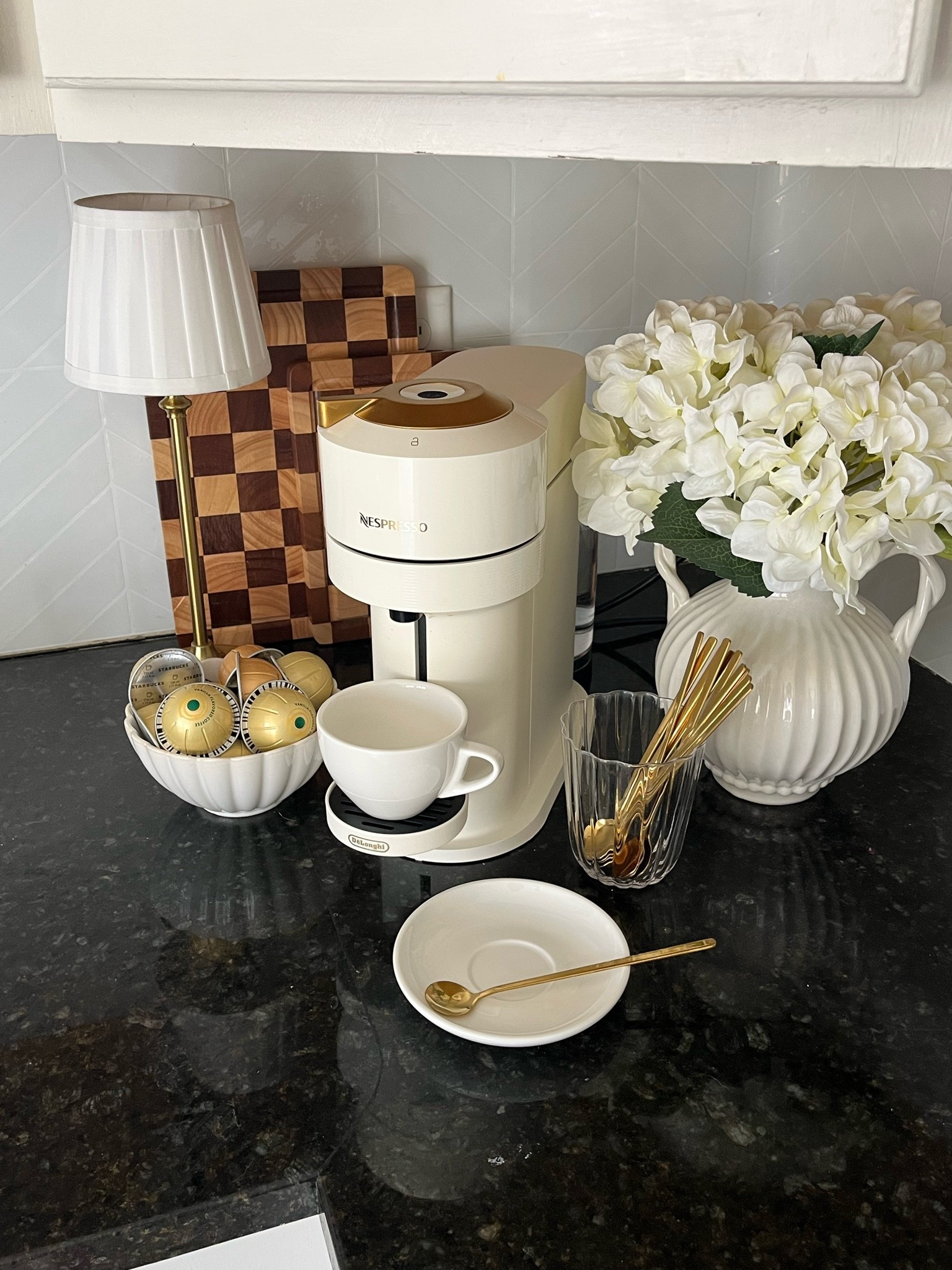 My new coffee bar set up in our kitchen ☕️ Of course I had to set up a little coffee station in our kitchen with my Nespresso Vertuo & all of the essentials 🤍

Coffee bar, Nespresso machine, espresso, at home latte, coffee at home, home decor, kitchen decor, kitchen counter, Ralph Lauren home decor

#LTKmorningroutine #LTKHome