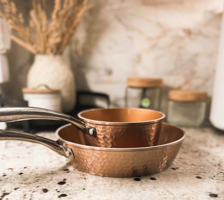 Copper hammered pot and pan set. 
We’ve had this set coming up on two years now and haven’t had any issues with any of the pots, pans & bakeware. 
Kitchen favorites, pot and pan set, copper pots and pan set, kitchen must haves. 

#LTKFind #LTKhome