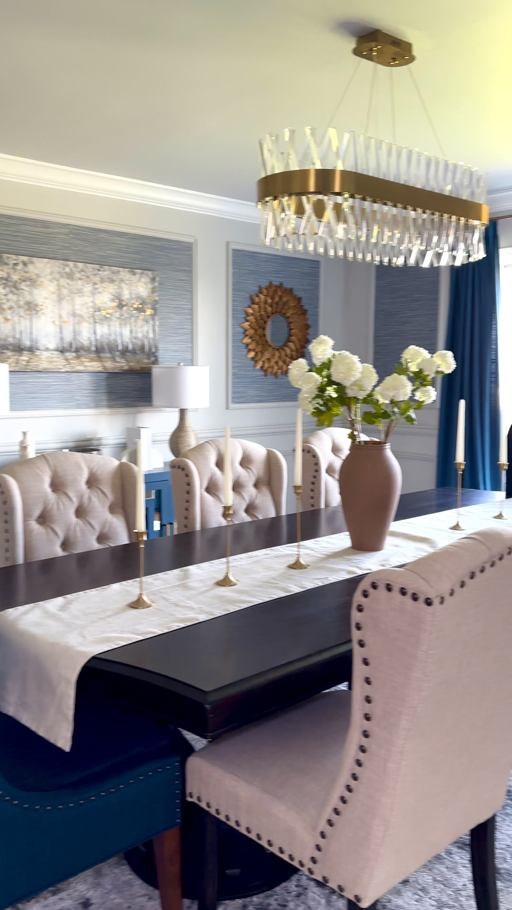 Dining room refresh. Dining room table. Decorative vase. Dining room decor. Snowballs. Faux florals. Chandelier. Candles. Tapes candles. Brass candlesticks. Table decor. Table runner. Curtains. Spring faux florals.

#LTKSeasonal #LTKhome #LTKstyletip