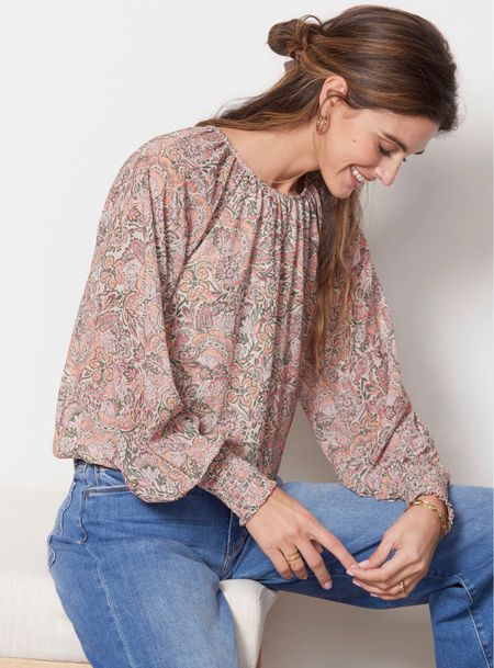 In my cart! Darling floral top with smocked cuffs. Flowy and romantic! Style with denim, trousers, or skirt. 

#LTKunder100 #LTKFind #LTKstyletip