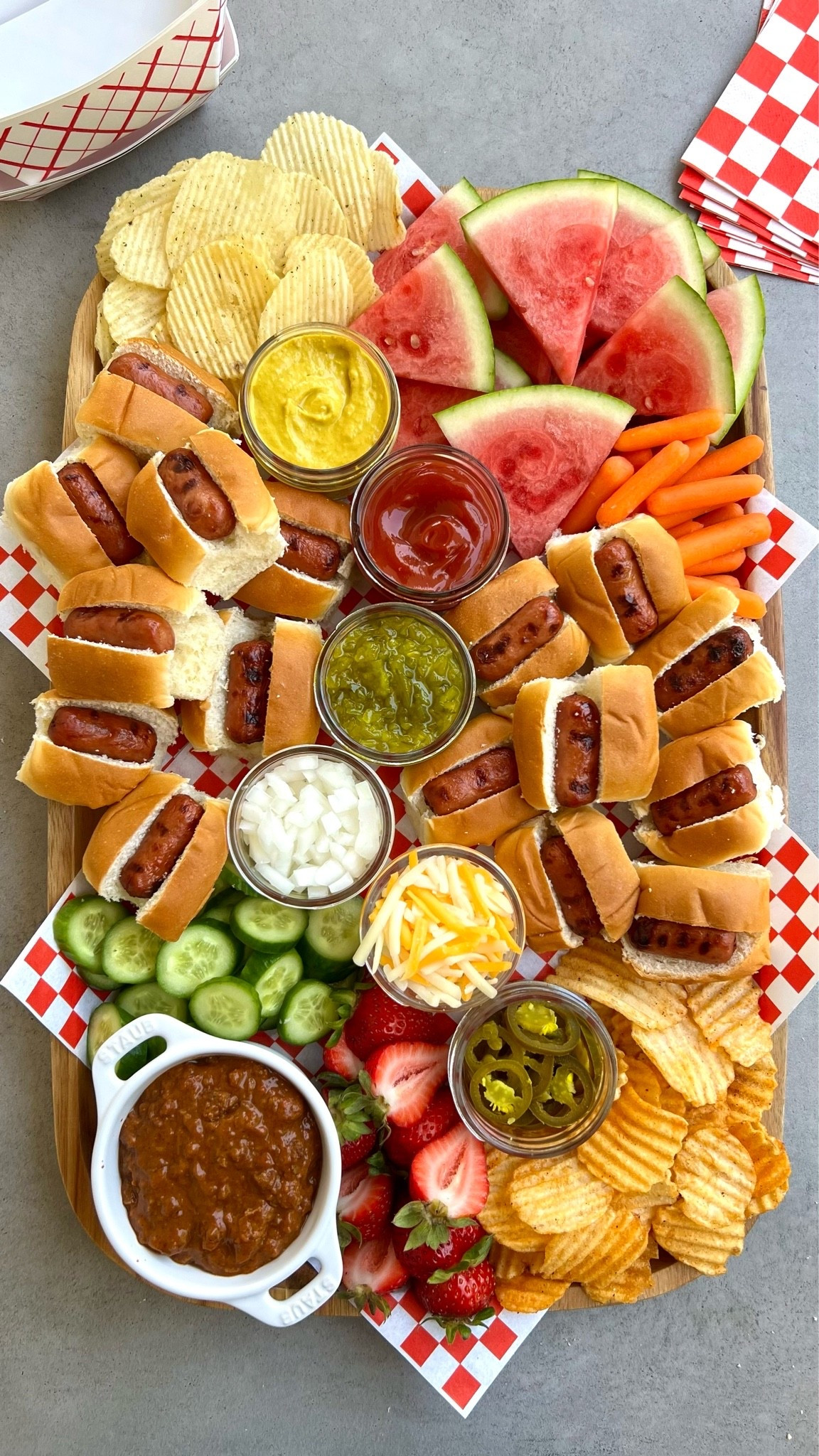 This Mini Hot Dog Board is the ultimate easy summer meal board! Loaded with grilled mini hot dogs, crunchy chips, fresh fruit and veggies, and all the best toppings, it’s a fun spread for cookouts, pool days, game nights, and casual family dinners

#LTKfoodie