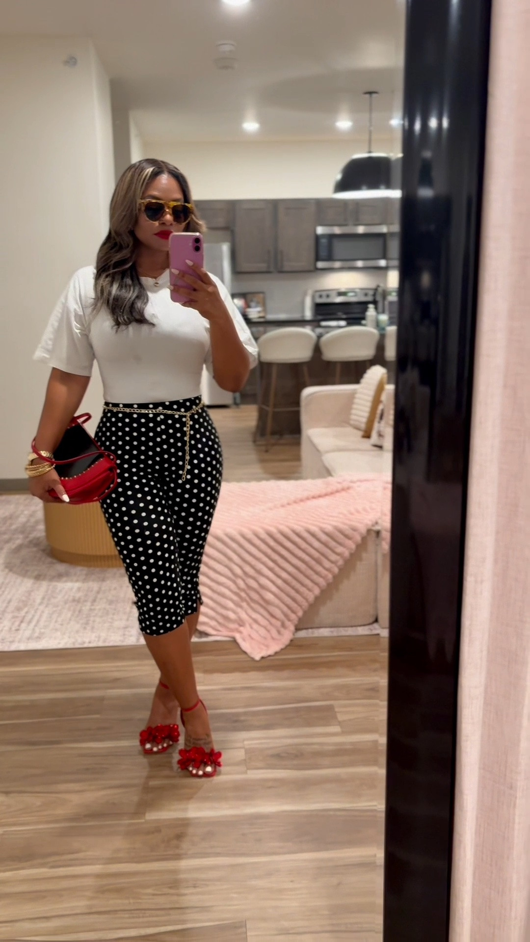 Recreate this girls night look 💃🏽

For this look, I wanted to give a little Selena-meets-Yoncé energy, and honestly, the mood came together so nicely!

I styled a classic cotton white t-shirt made with oversized sleeves and cinched waist accents, with these black-based polka dot capri pants. The capris are made of a stretch material (note: they are not one-size-fits-all!). I completed the outfit with a pop of bold red—featuring the Rihanna MVP red matte lip, a cute red clutch, leopard sunglasses, and Steve Madden red heels with flower accents to bring the whole mood to life. 🌹

Fit & Sizing Details
 My Stats: 5’2” | 147 lbs
 Top: Size Small
 Bottoms: Size Medium

#LTKgrwm #LTKootd #LTKPetite