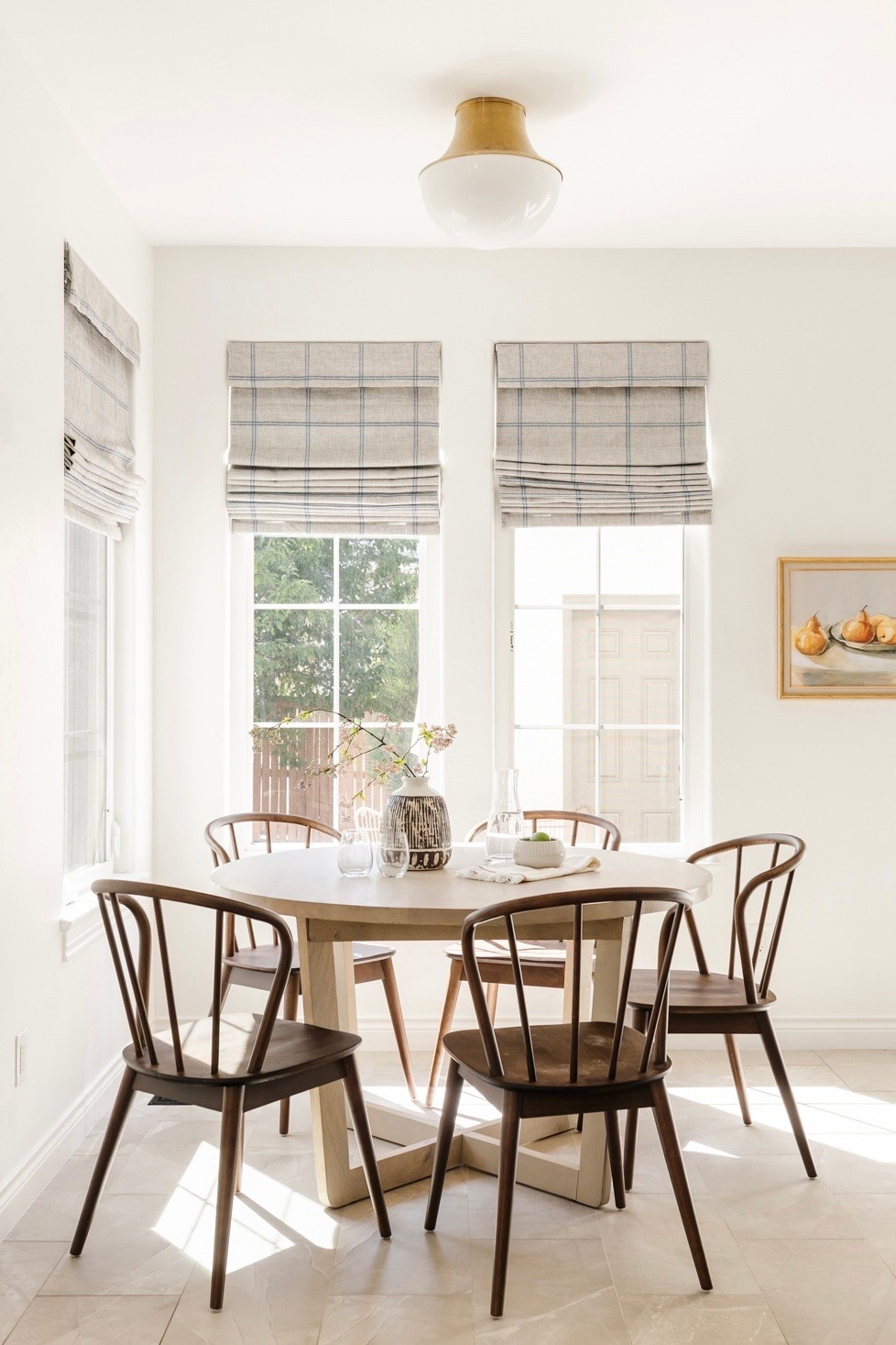 Light wood round dining table with vintage inspired dining chairs 

Kitchen seating, dining, breakfast nook, art

#LTKHome