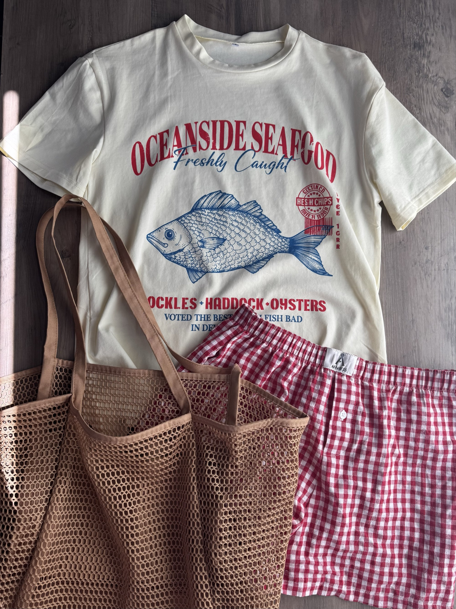 Summer graphic tee with red gingham boxer shorts, and mesh tote bag. 






Amazon outfits every outfit inspo, outfit ideas, casual outfits amazon, amazon outfits every day, spring outfits 2026, summer outfits, coastal outfit, coastal graphic tee, fish graphic tee, 

#LTKPetite #LTKSaleAlert #LTKTravel