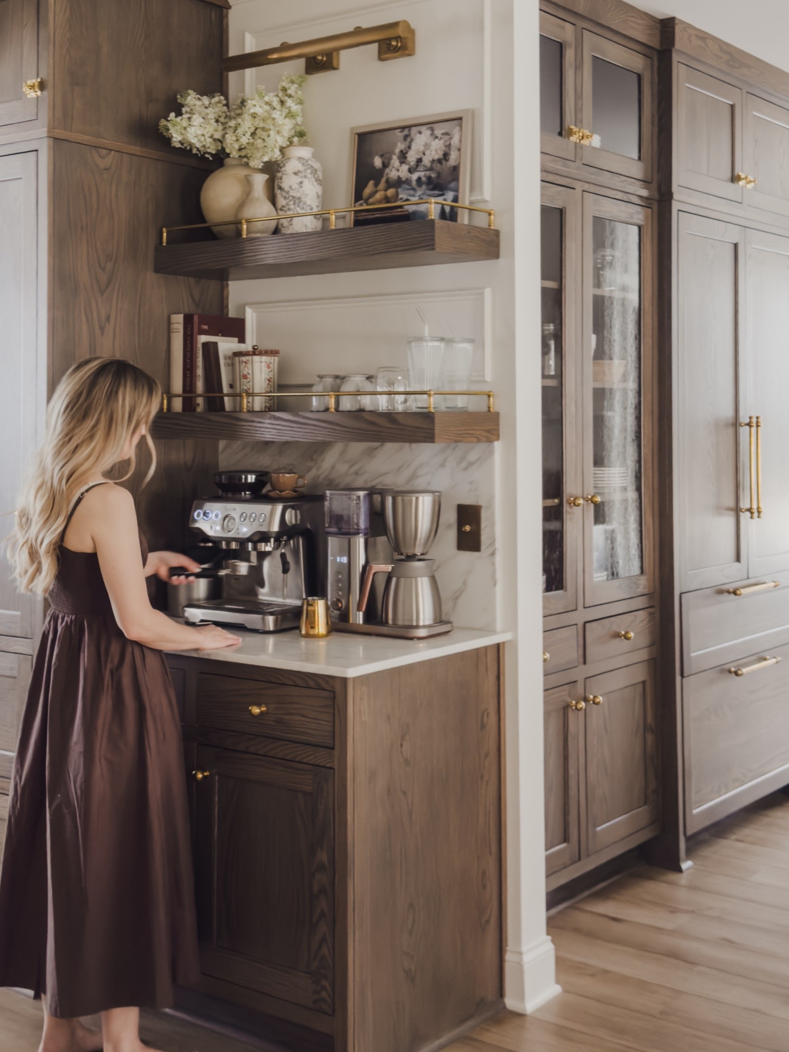 Our coffee bar might be one of our most used spots — okay, maybe not the most used, but we’re here multiple times a day.

Splurging on our espresso machine was one of the best decisions we’ve made. It makes such quality coffee, and we’re saving money with fewer trips to the coffee shop.

This space was all about the details: the rich wood cabinetry and the unlacquered brass that will patina over time, making it feel even more timeless. Sharing all the details, plus a few look for less options.



Abercrombie spring dress style, coffee bar, kitchen details, home inspo, rejuvenation, pottery barn, brass details, Etsy finds, shop the look! 

#LTKdayinmylife #LTKSaleAlert #LTKHome