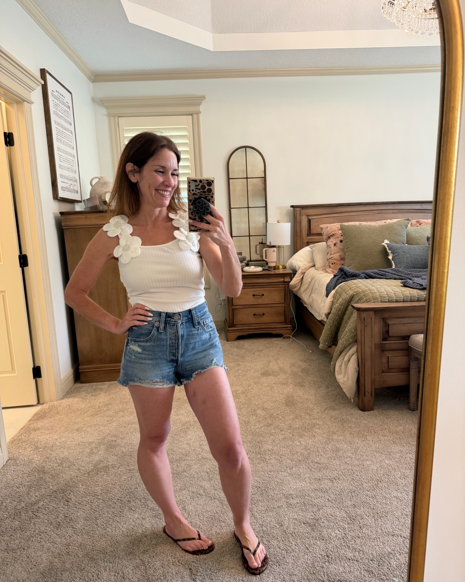 Sometimes it’s the little details that make an outfit. 🤍🌸

I fell in love with the floral shoulder detail on this tank! Paired with classic denim shorts, it’s the perfect outfit for everything from running errands to brunch, vacation, or a casual summer night out.

Simple, comfortable, and easy to style… exactly the kind of pieces I love having in my closet.

I’ve linked everything in my LTK if you’d like to shop the look! ✨

Now I need your opinion…
Would you wear this top with:
💙 Denim shorts
🤍 White jeans
👖 Wide-leg denim
🌸 A flowy skirt

Tell me your favorite below! 👇

#LTKStyle #LTKFinds #SummerStyle #DenimShorts #CasualChic #PetiteFashion #EverydayOutfit #SummerFashion #EffortlessStyle #OOTD

#LTKootd #LTKOver40 #LTKPetite