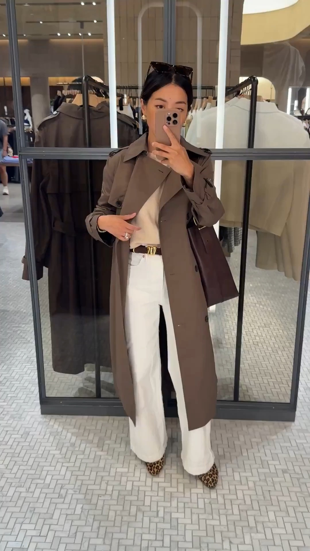 • wide leg ankle jeans size 24 regular (not petite) 
waist runs bigger but I love the wider cut and length on these with flats and sneakers.
• Aritzia trench coat 2XS sleeves a little long on me. Otherwise slim fit and a chic midi length. Water resistant in light rain 

• Quince lightweight cotton Dolman sweater xs - loose oversized cut with an easy, sophisticated look. Xs is a generous fit. I usually tuck this and you can shrink by machine drying 

• Sezane leopard Matilda ballerina flats - worn with heel lifts so the sides don’t rub my ankles

• Madewell bucket tote, original size easily fits a laptop.

• BP sunglasses

Spring 2026 casual outfit that also works for smart casual office workwear, mom style, petite friendly

#LTKPetite #LTKootd #LTKmomlife