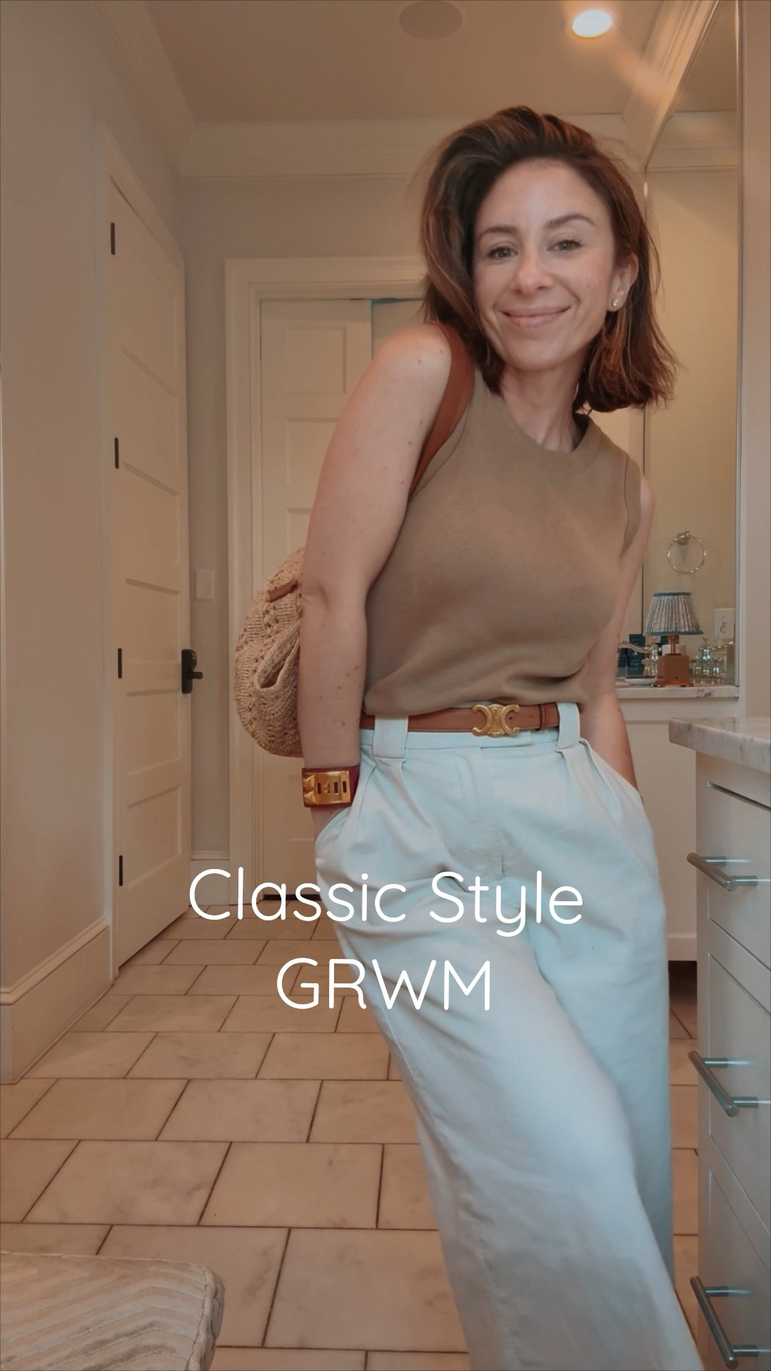 Classic daytime style in wide leg khaki trousers, the perfect reminder sweater shell, leather accessories 

#LTKStyleTip