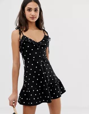 ASOS DESIGN mini sundress with button front and pep hem in polka dot | ASOS US
