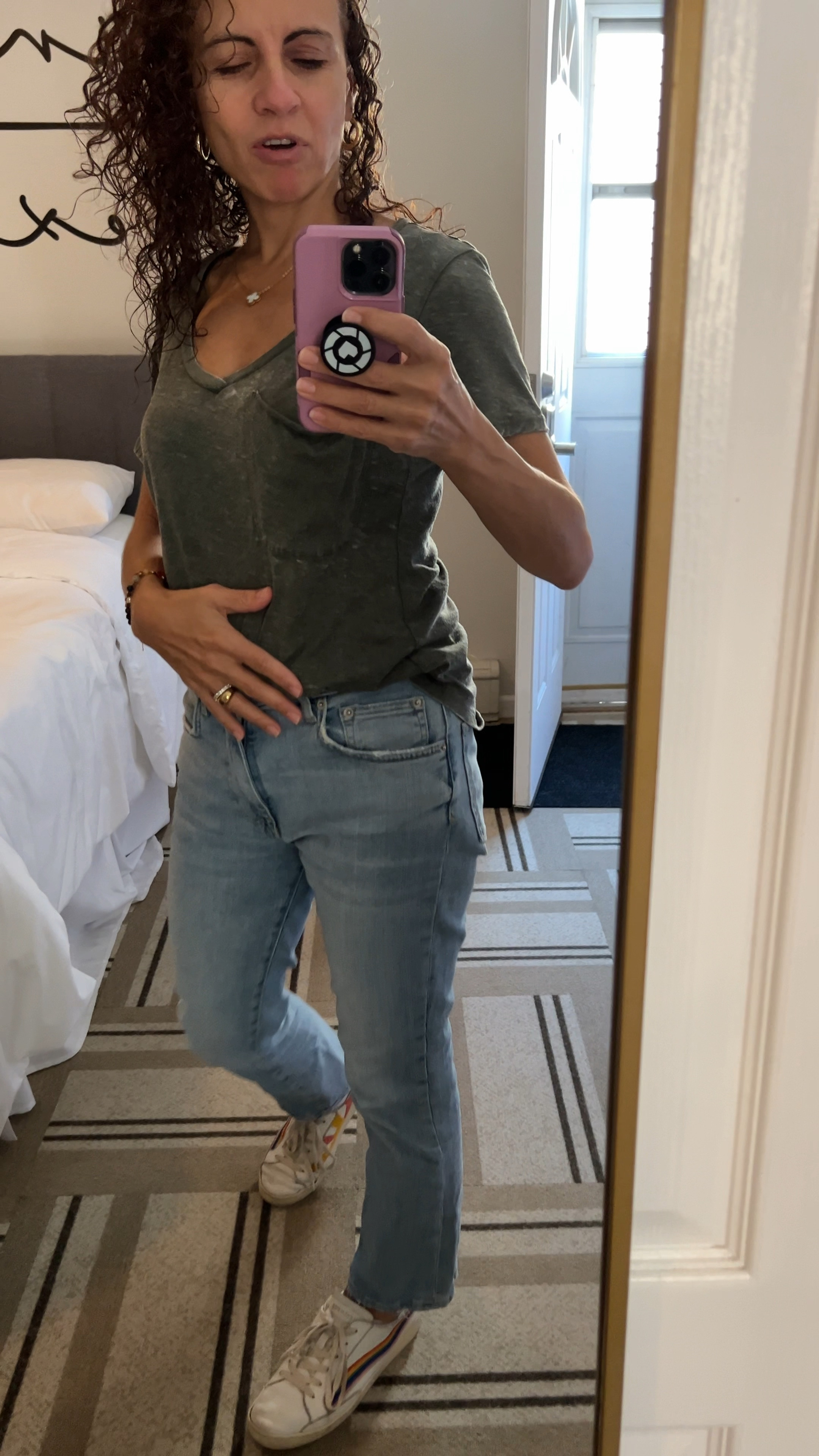 Fall fashion look for today. Olive t shirt with light wash jeans and solids good vibes rainbow sneakers. Paired with gold jewelry. Timeless fashion.  Gold mirror is perfect for checking yourself.

#LTKVideo #LTKOver40 #LTKStyleTip