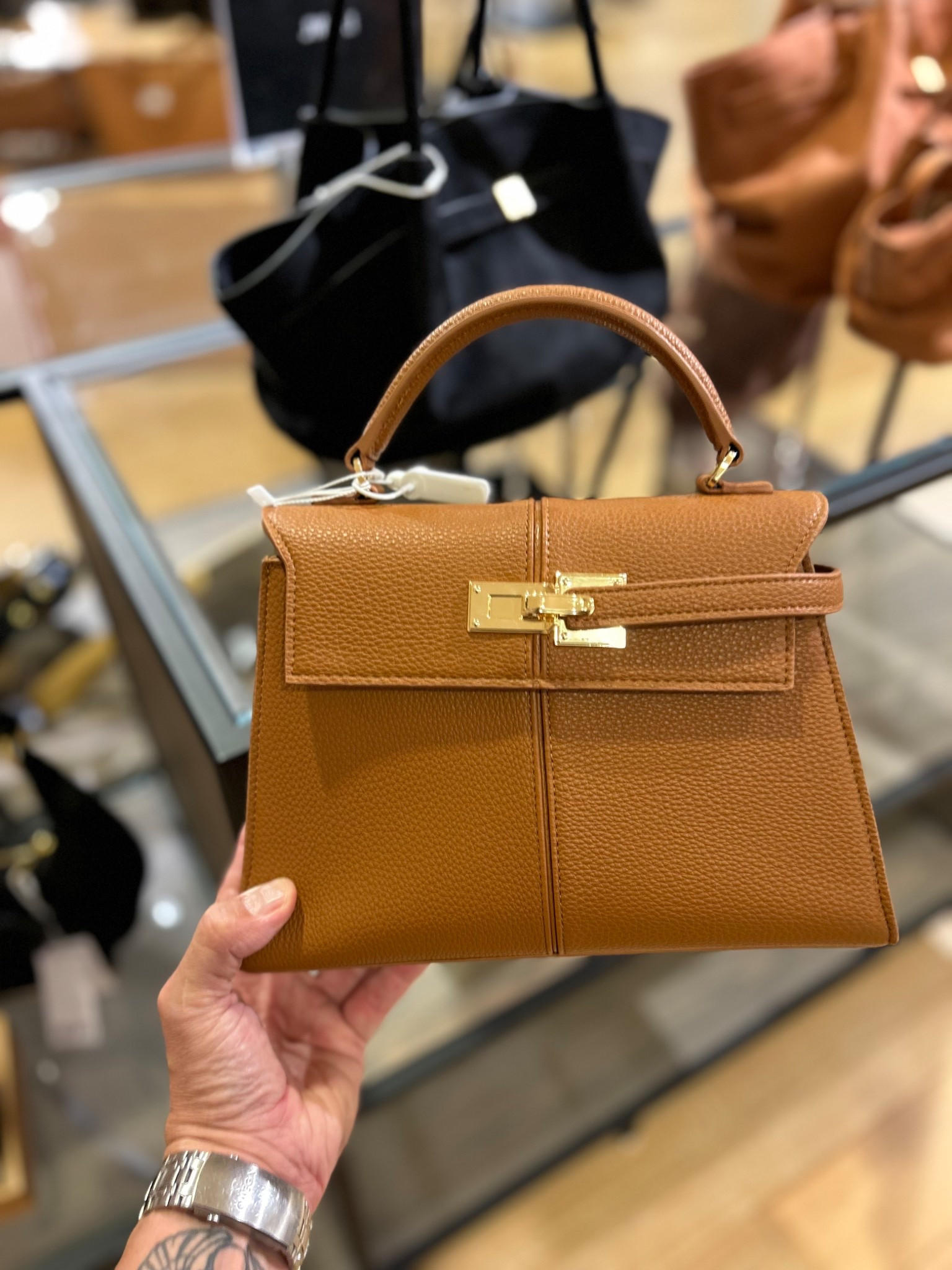 Looking for a super cute lil bag that harkens of the Hermés “Kelly” but is a FRACTION of the price?! Then have I got something for you!

This offering comes in a wide range of colors (to suit every season), is the “proper size” (perfect for a wallet and phone and few other items), is a super classic shape and with its material choice makes it easy to dress up or down AND is a great price point! 

This is primed to be the next “it” bag. Or at least it should be  

#LTKSeasonal #LTKItBag #LTKStyleTip