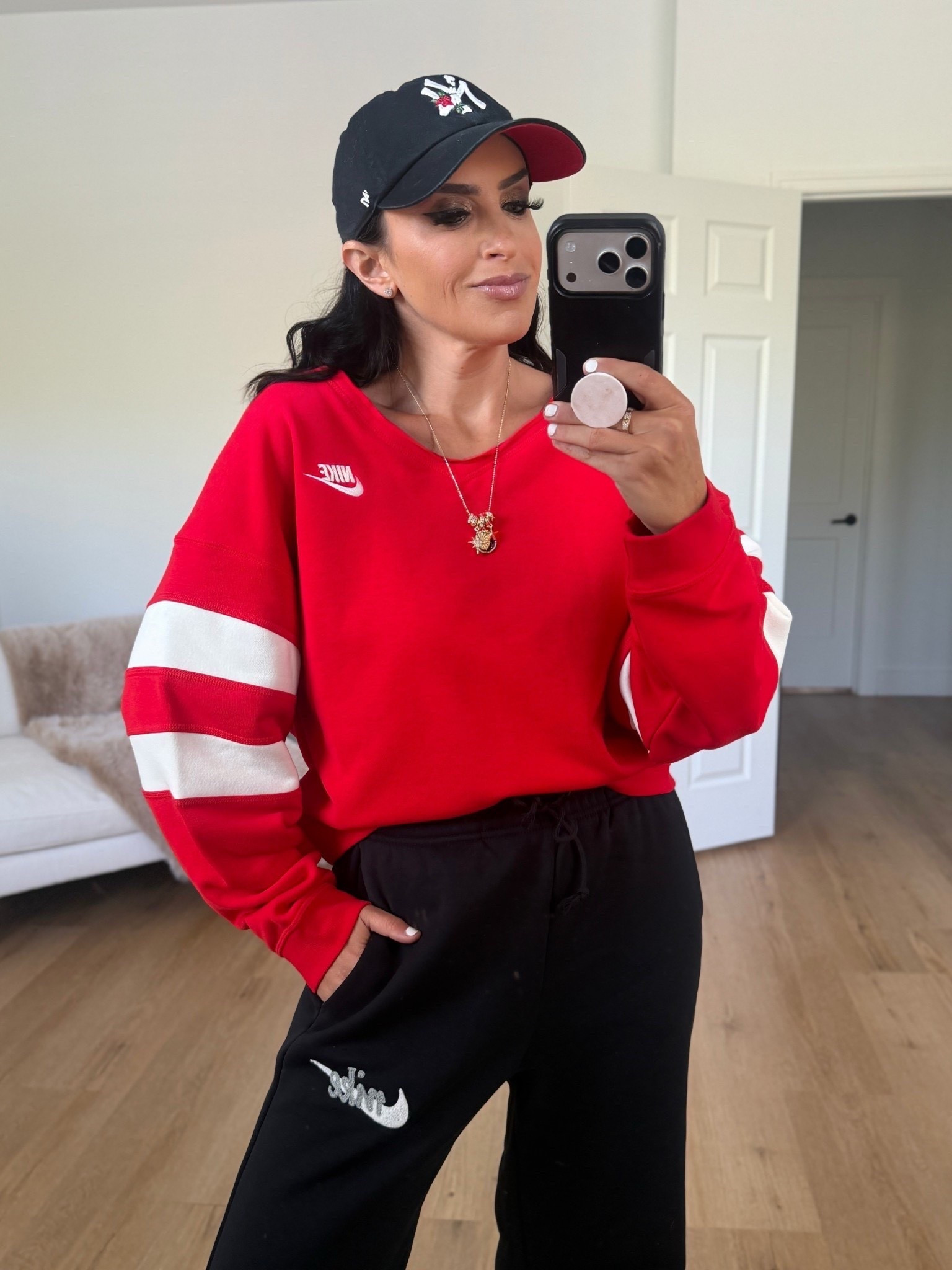 Nike sportswear club fleece women’s oversized v neck sweatshirt in university red sail wearing size small 

Now $48 originally $80
With code lastshot