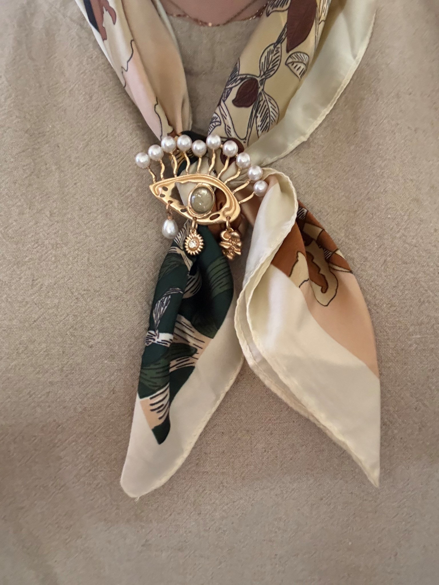 This cute scarf and pin has been on major repeat. I linked a couple of similar scarfs and pins most of them under $10

#LTKSeasonal #LTKgrwm