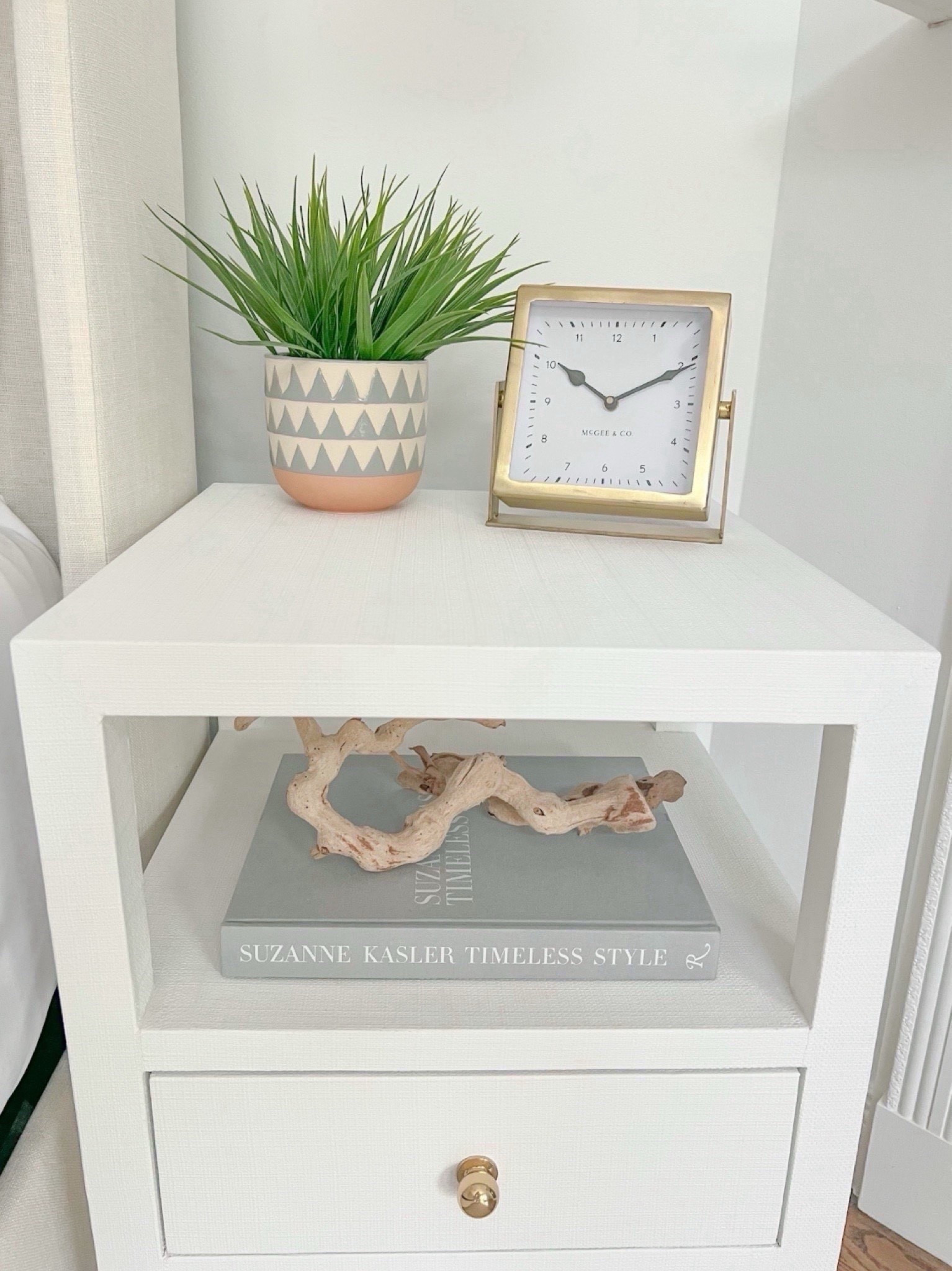 I keep my nightstand styling pretty simple in our primary bedroom!
- 
Coastal Nightstands, primary bedroom decor, coastal home decor, coastal styling, beach home decor, beach house style, coastal bedroom, coastal interior, coastal decorating, white nightstand, faux plant, gold clock, 2 drawer end table, end table, upholstered bed, blue and white geometric pot, planter, table clock, bedroom styling, neutral home, nightstand styling, nightstand decor, coastal nightstands, beach house bedroom, beach house nightstands, Amazon coffee table books, driftwood branch, shelf styling, Nightstands with shelf, nightstands with drawers, Wayfair nightstands, table clock, neutral coffee table book, narrow nightstands, small nightstands, bedroom ideas, beach house bedroom decor

#LTKFindsUnder100 #LTKFindsUnder50 #LTKHome