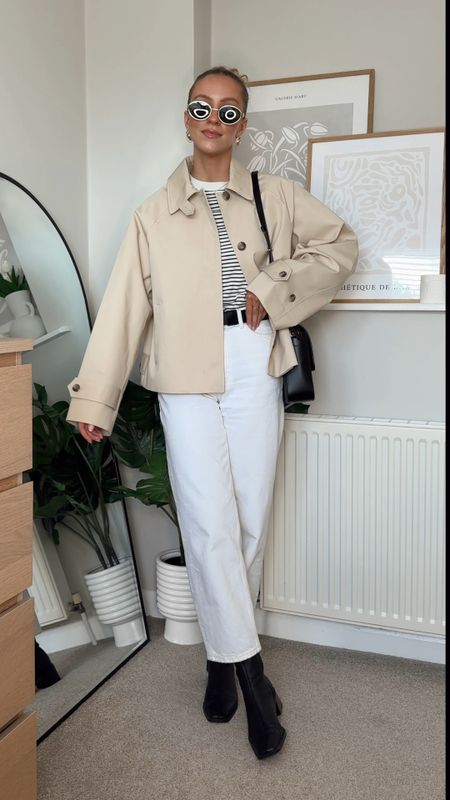 Cropped trench coat, spring outfit, white jeans, barrel leg jeans, striped tshirt, black cross body bag, black square heel boots, celine dupe sunglasses with gold frames, clarins lip oil 

#LTKeurope #LTKSeasonal #LTKstyletip